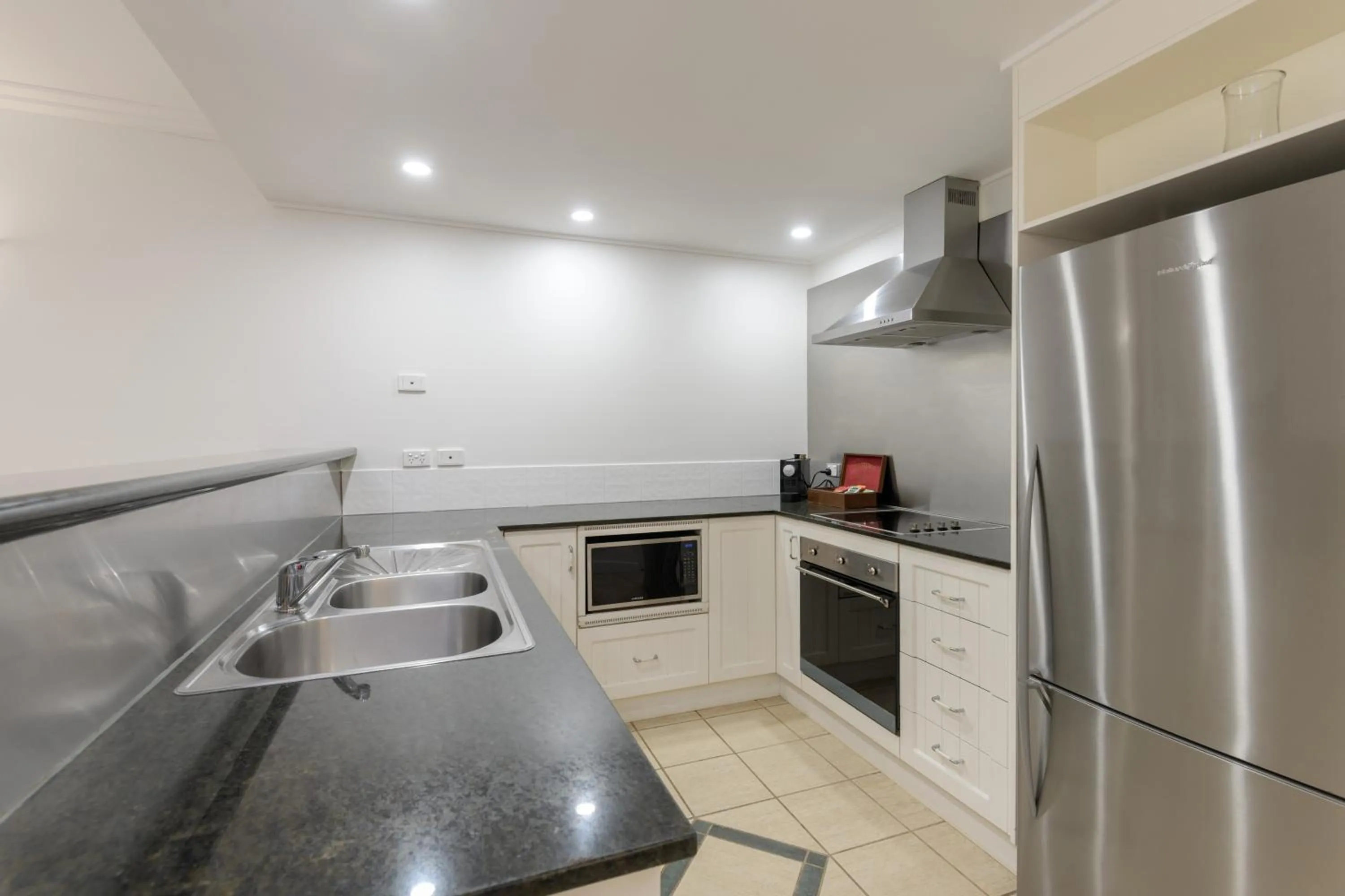 Kitchen or kitchenette in Mandalay Luxury Beachfront Apartments