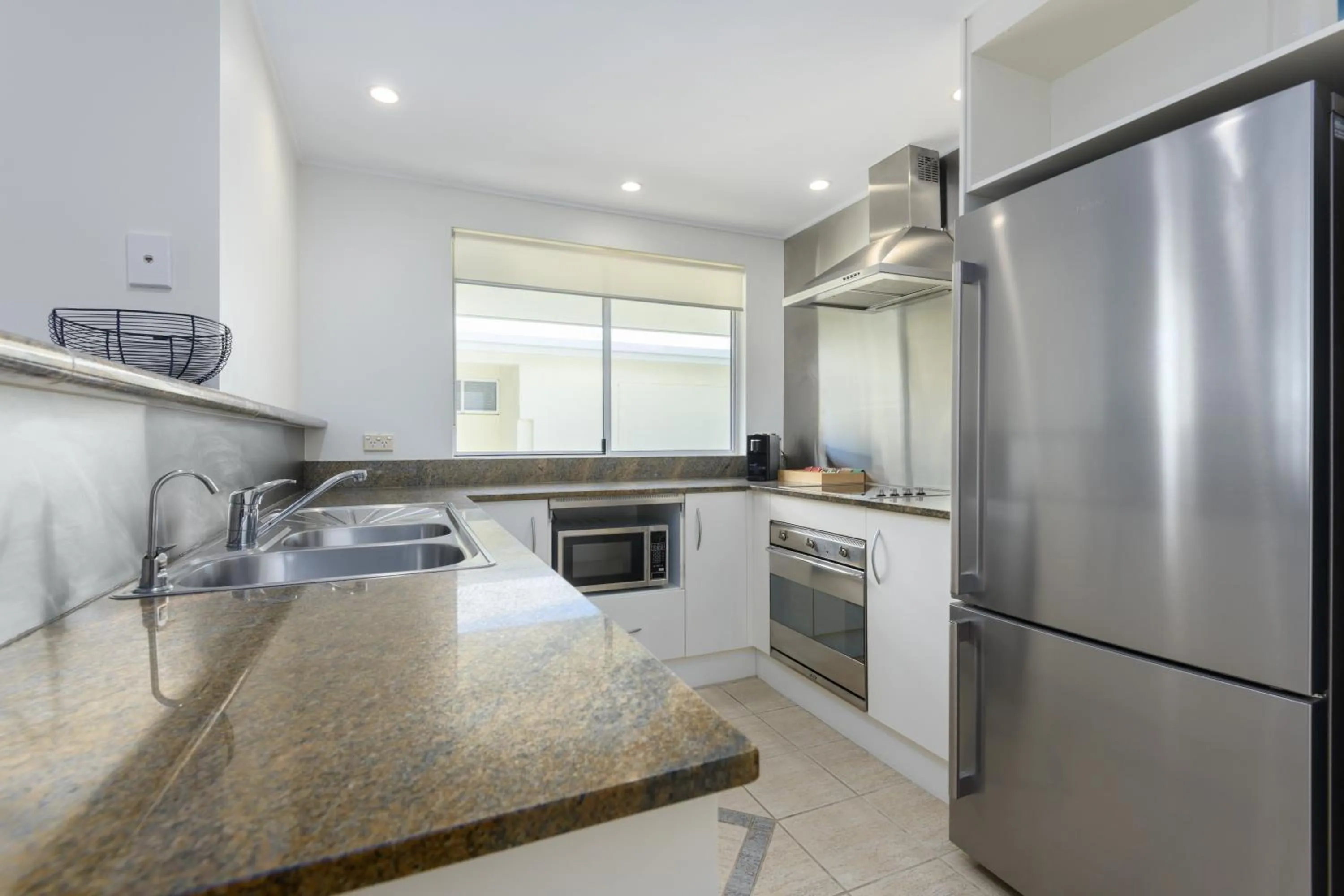 Kitchen or kitchenette in Mandalay Luxury Beachfront Apartments