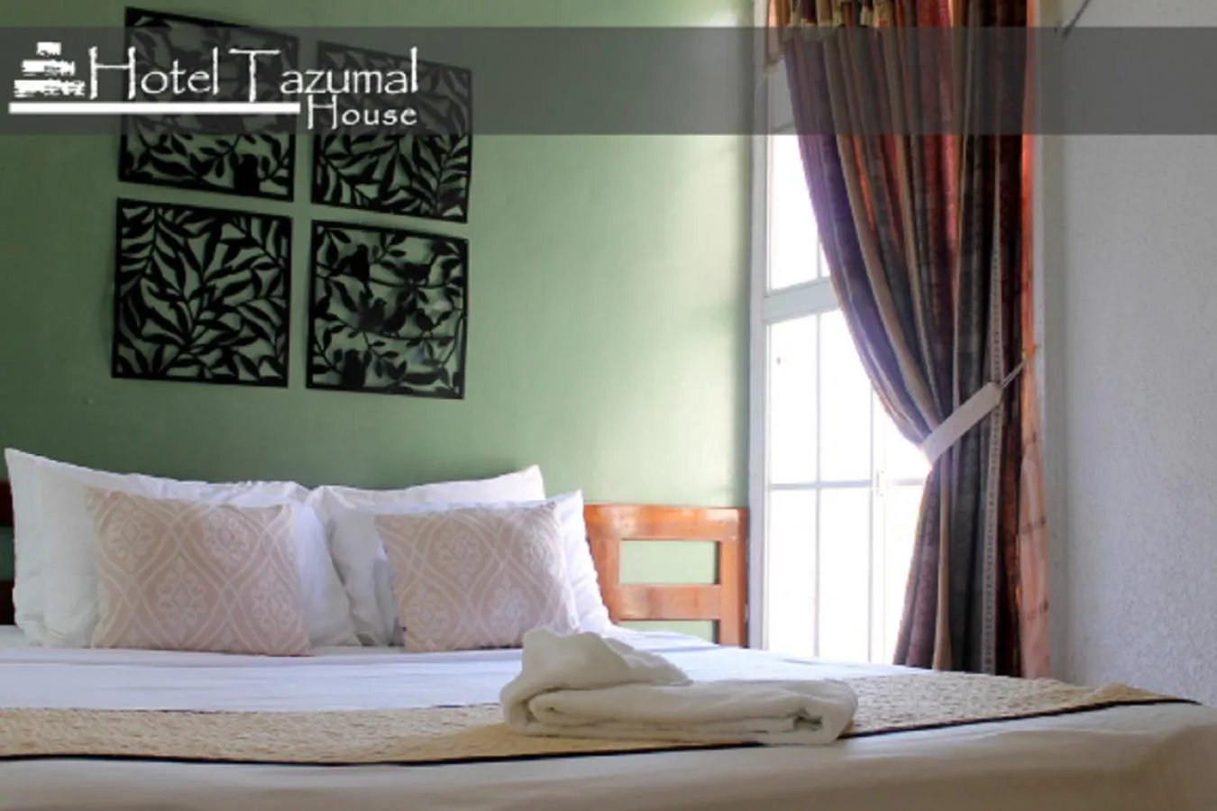 Bed in Hotel Tazumal House