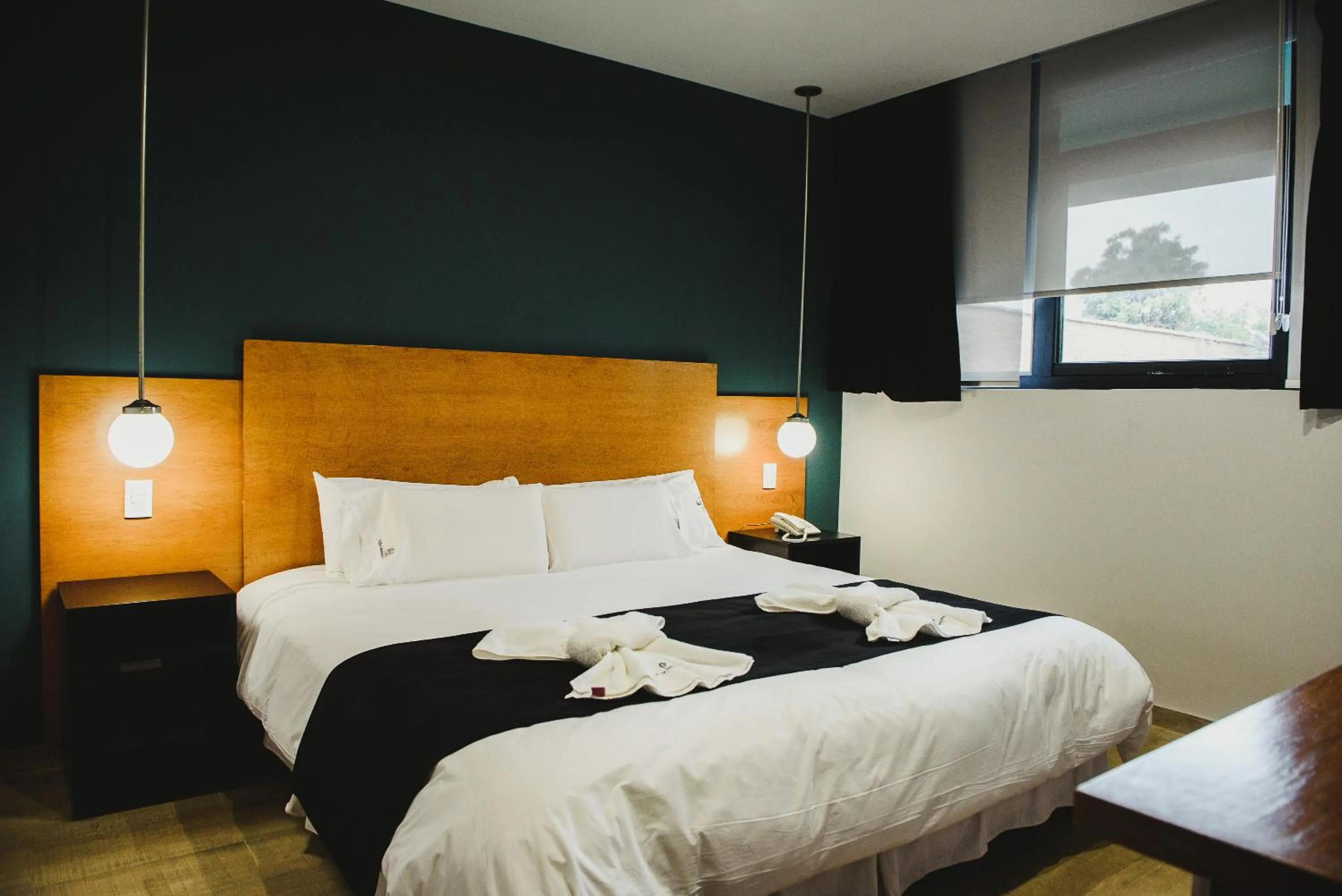 Bed in Plaza Paradiso Petit Hotel