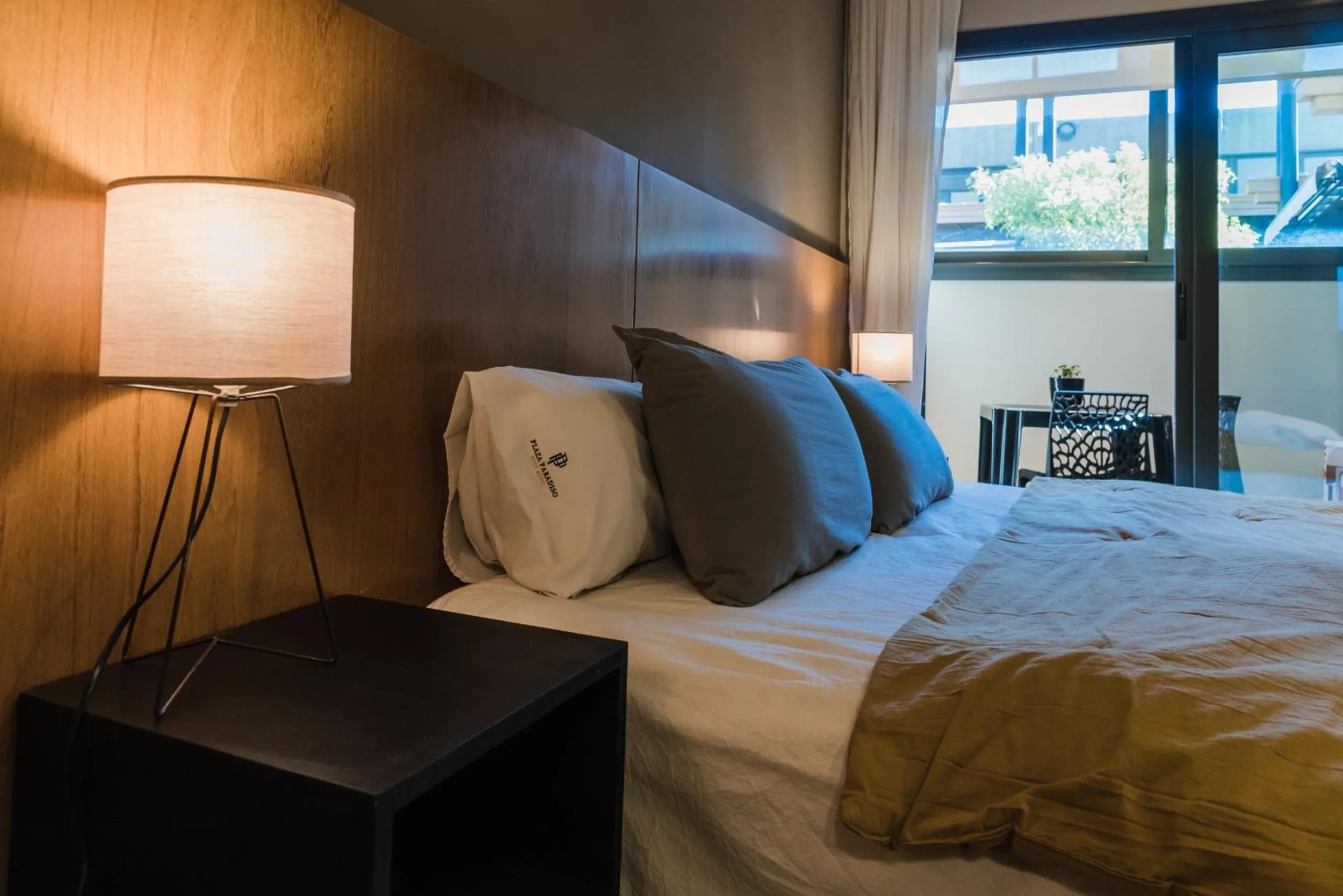 Bed in Plaza Paradiso Petit Hotel