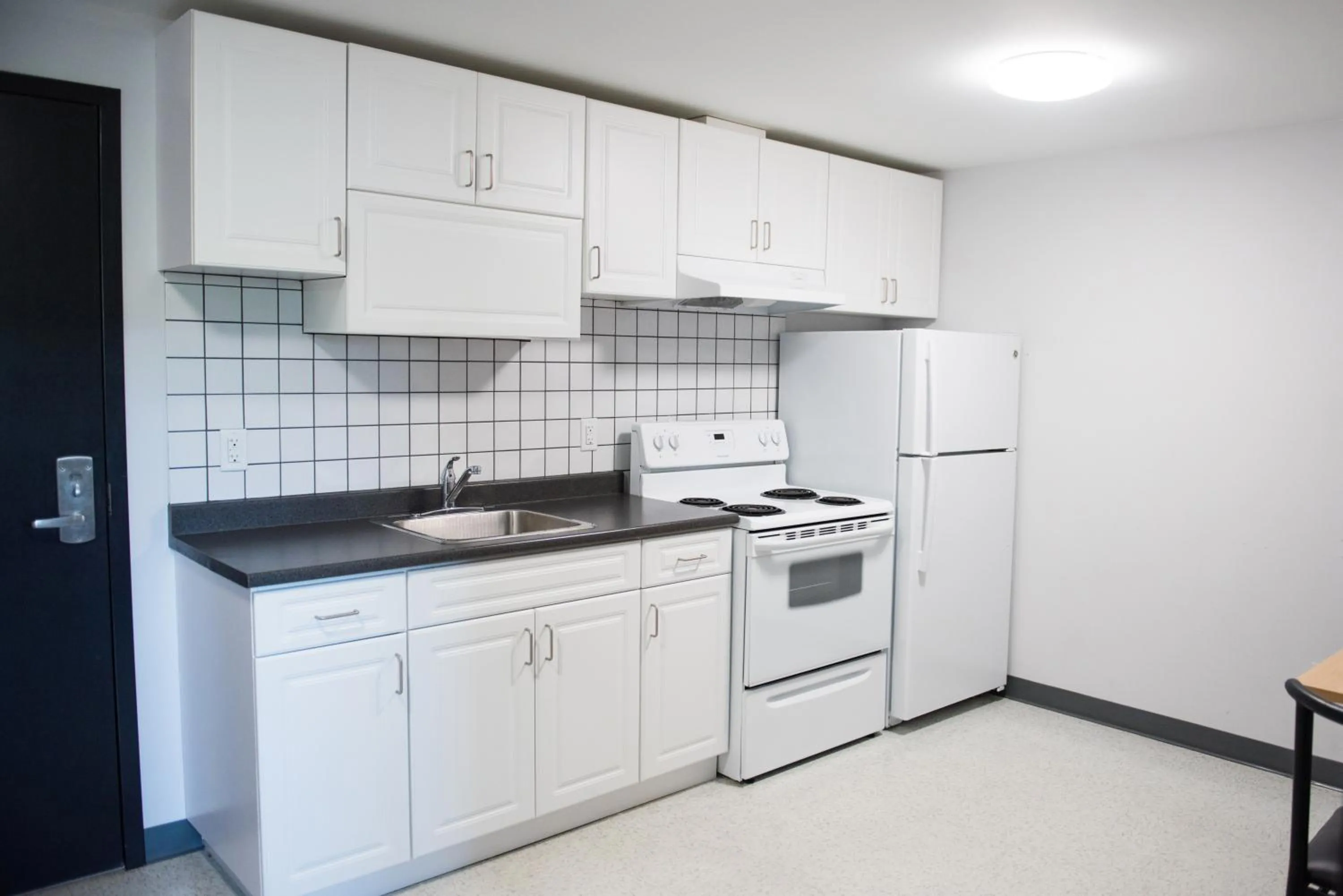 Kitchen or kitchenette in Residence & Conference Centre - North Bay
