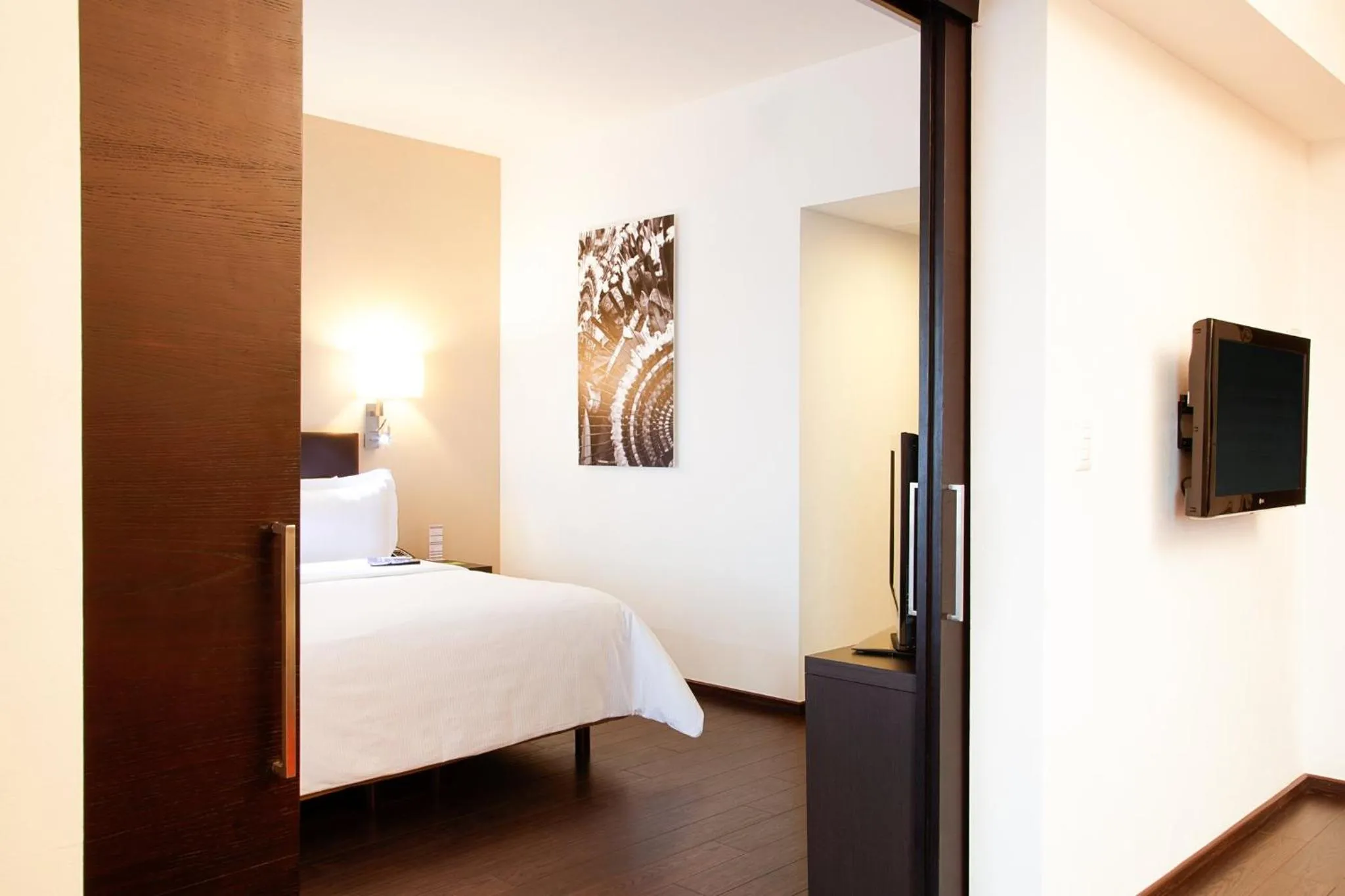 Photo of the whole room, Bed in Fiesta Inn Puebla Las Animas