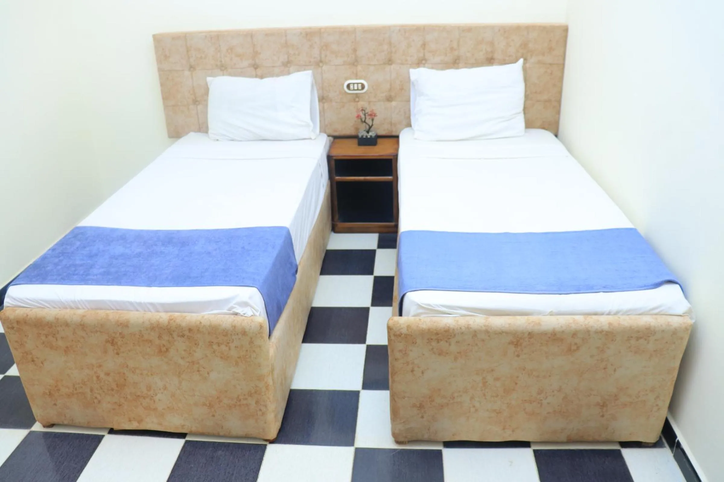 Bed in Royal City Hotel