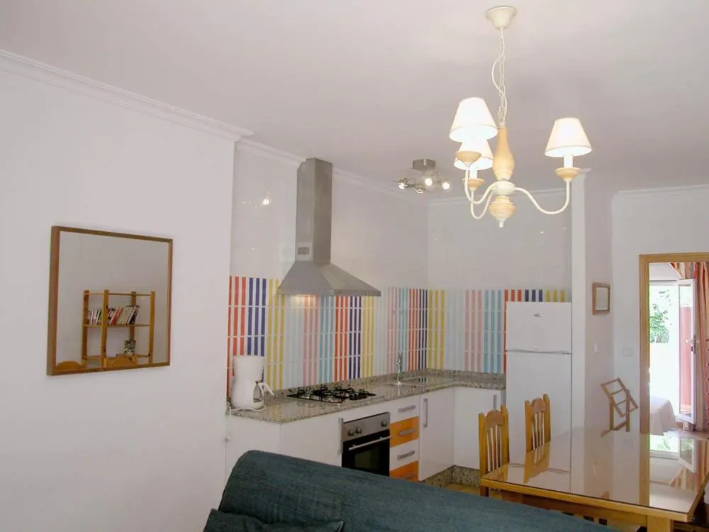 Kitchen or kitchenette in Apartamentos Oasis de las Palmeras