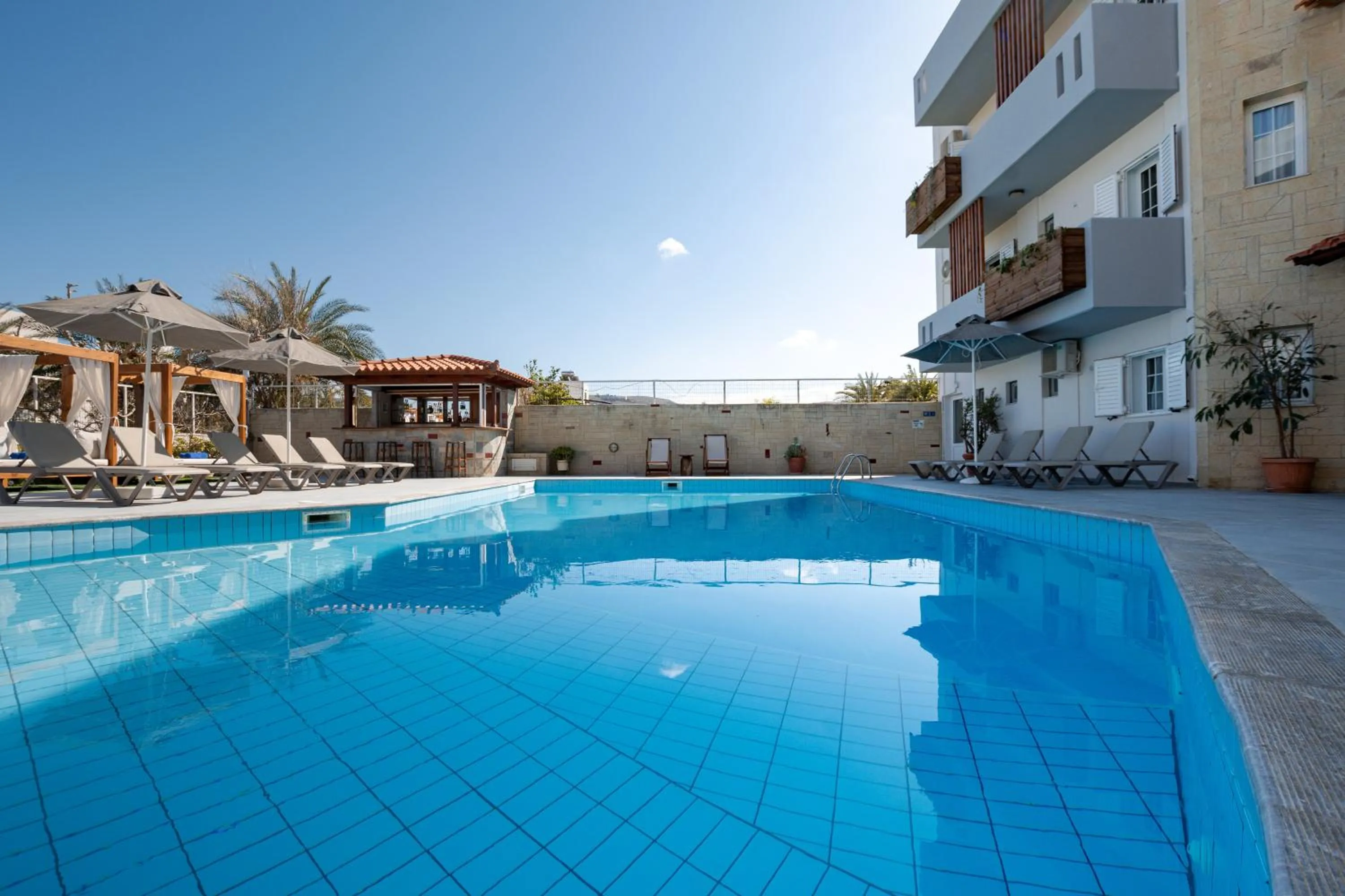 Pool view in Dimitra Hotel & Apartments by Omilos Hotels
