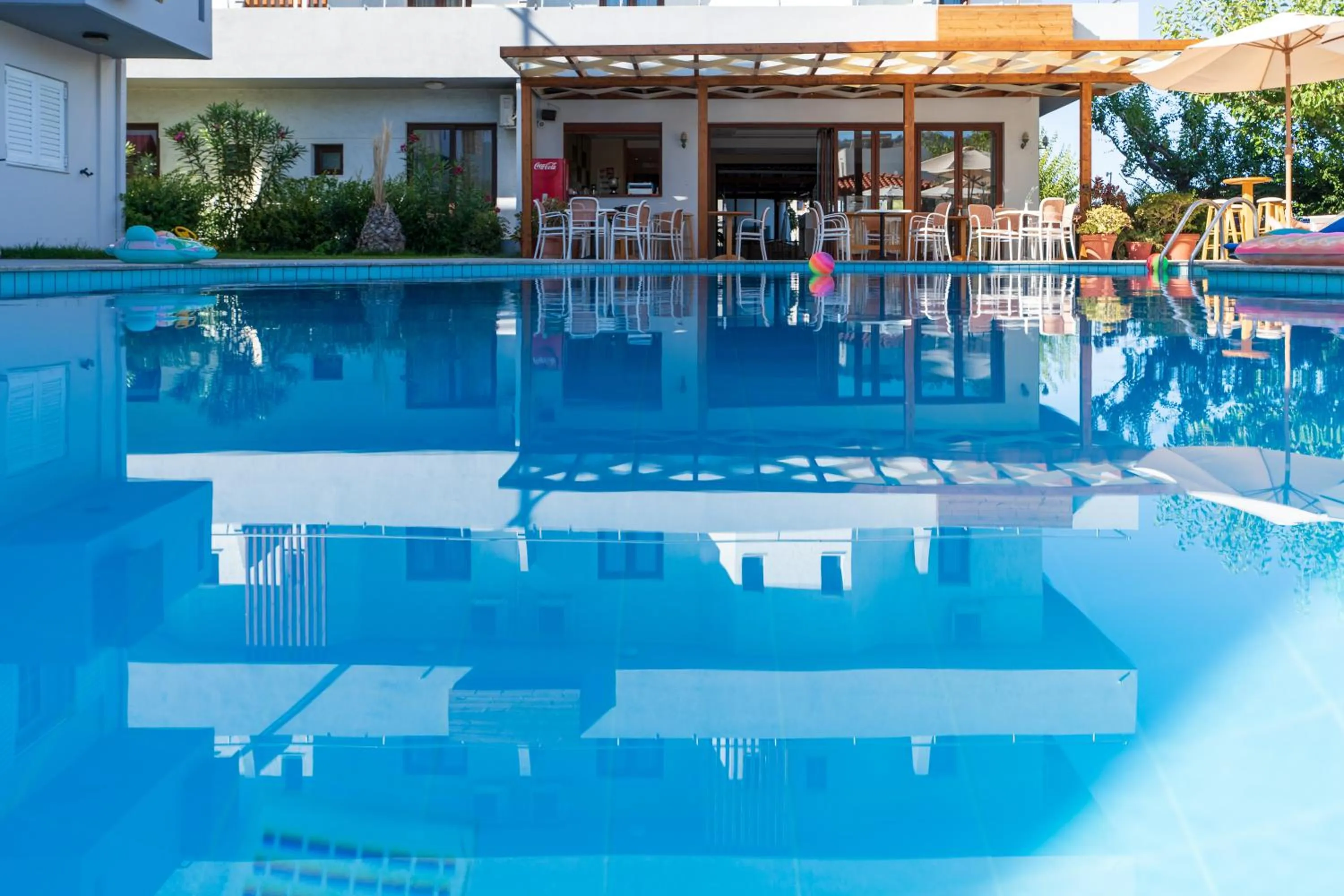 Swimming pool in Dimitra Hotel & Apartments by Omilos Hotels