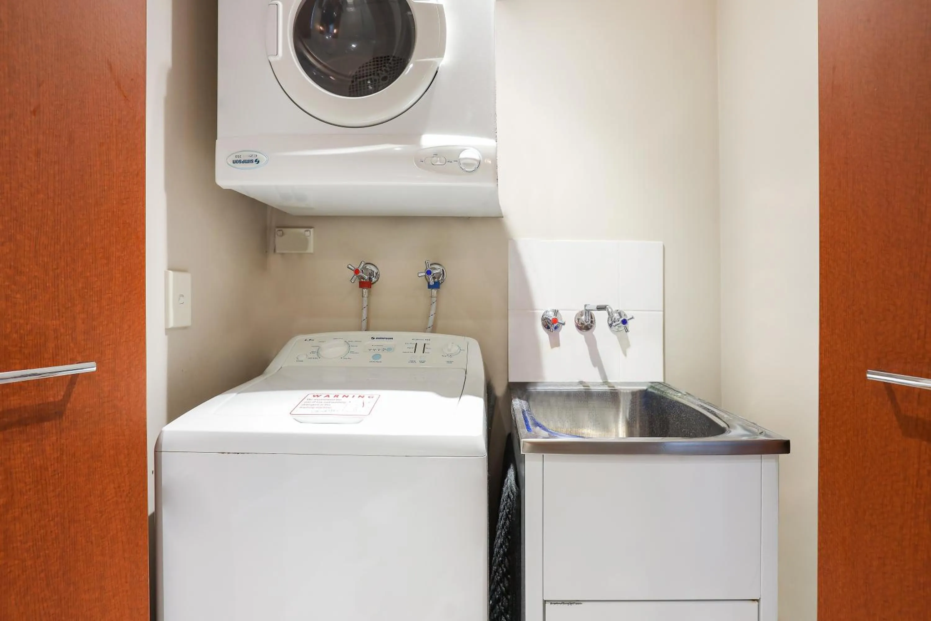 washing machine in Chevron Renaissance | High Floor Ocean View Apartments by Gold Coast Holidays