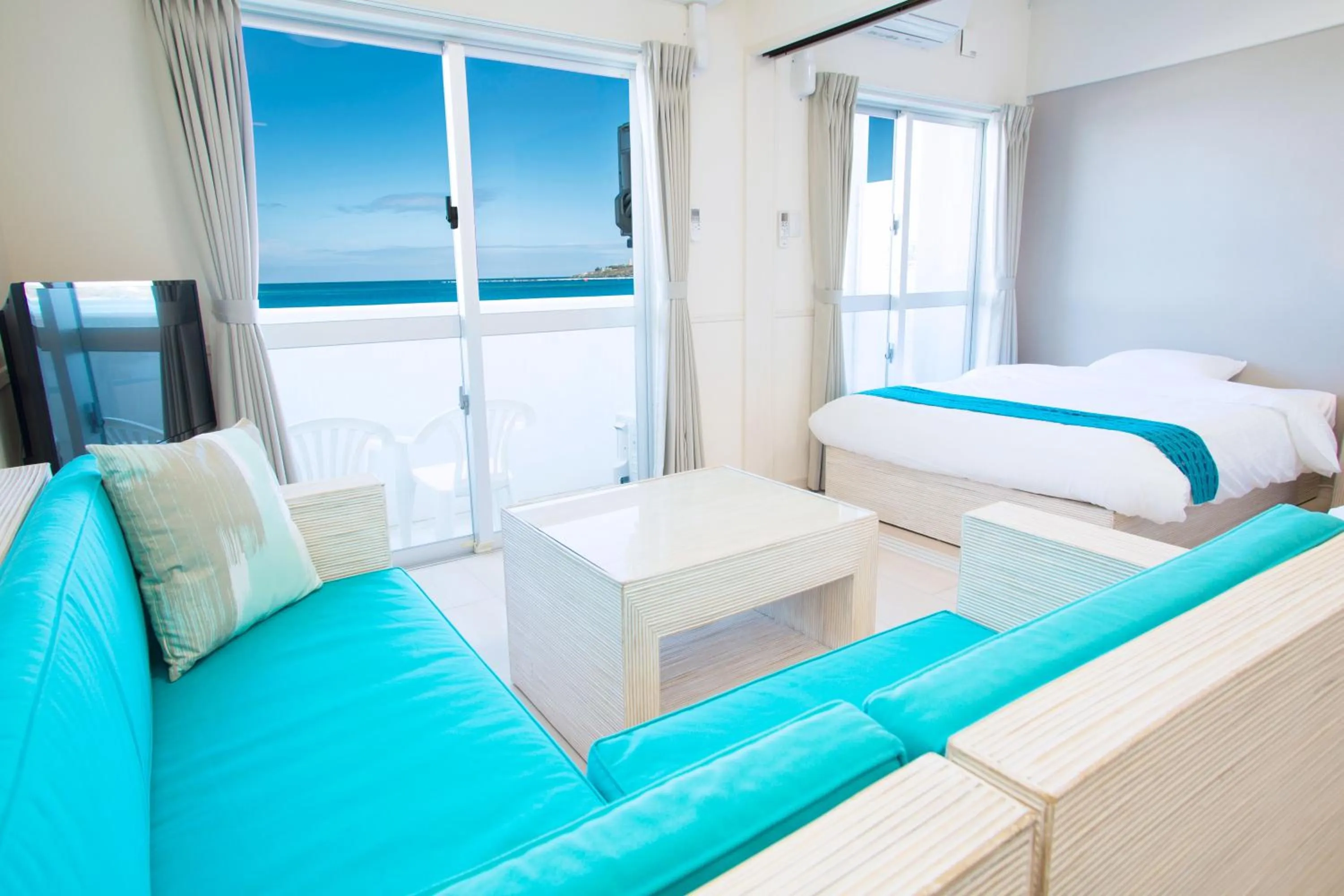 Living room, Bed in Costa Bella Condominium Resort