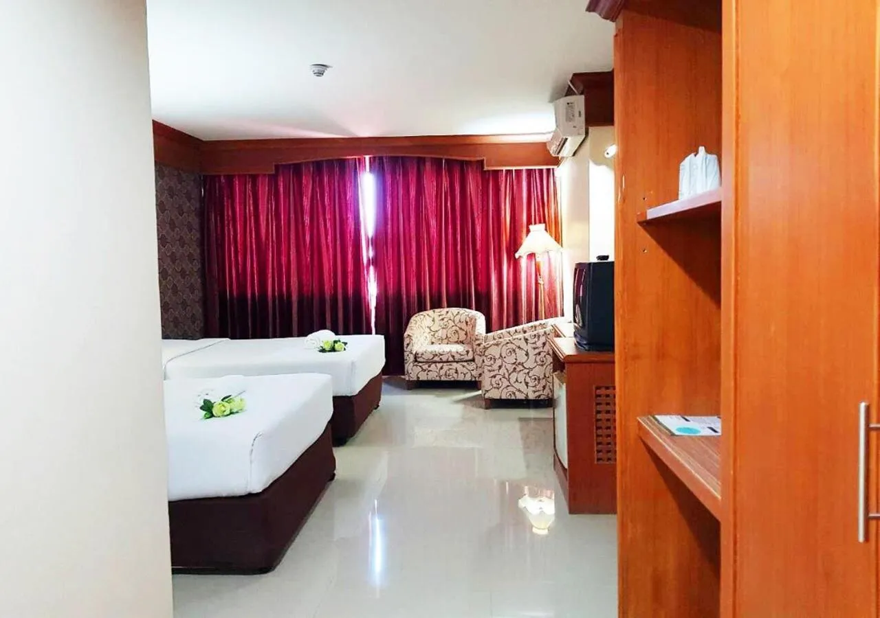 Bed in JP Emerald Hotel