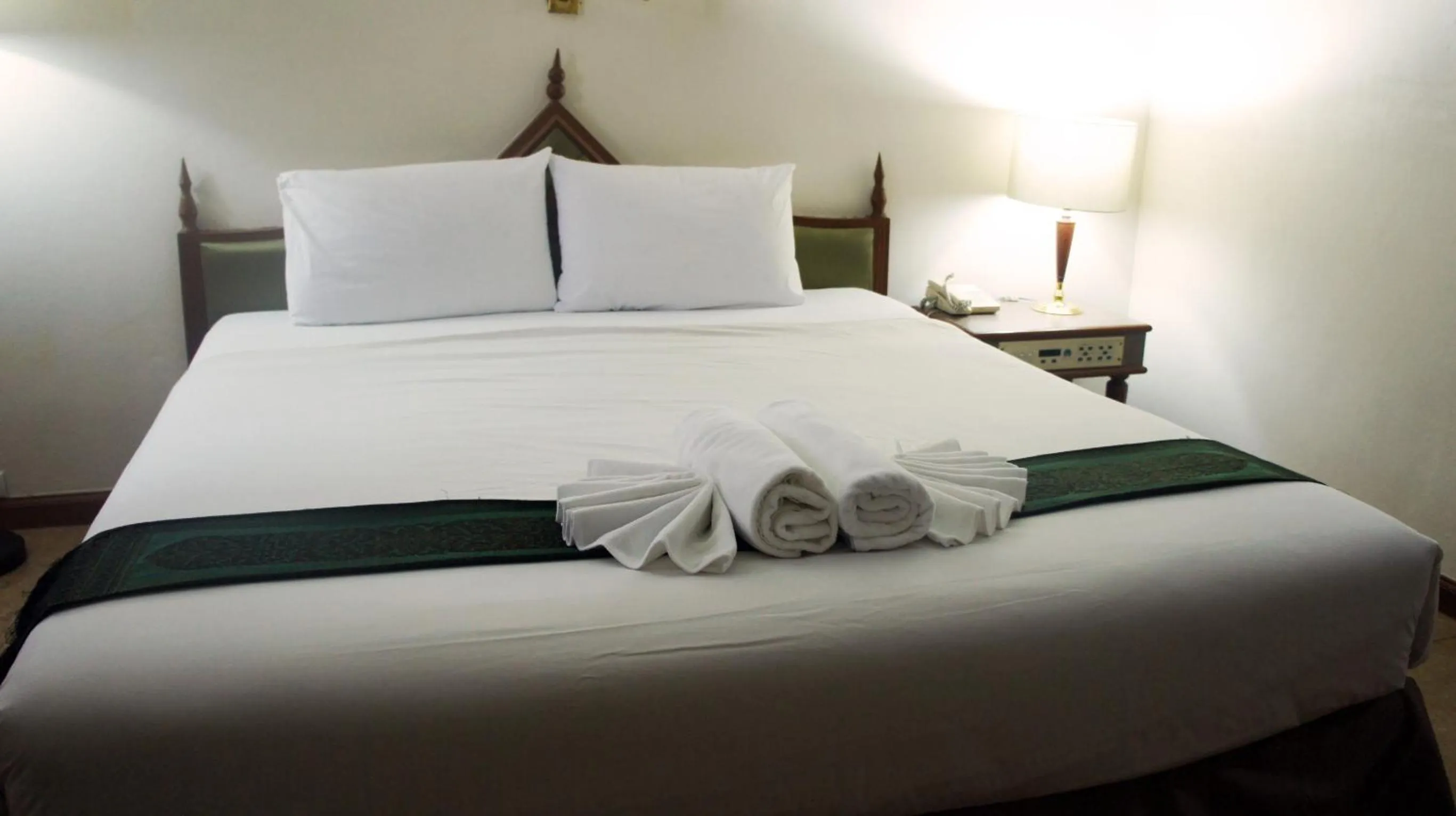 Bed in JP Emerald Hotel