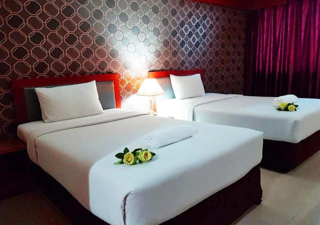 Bed in JP Emerald Hotel