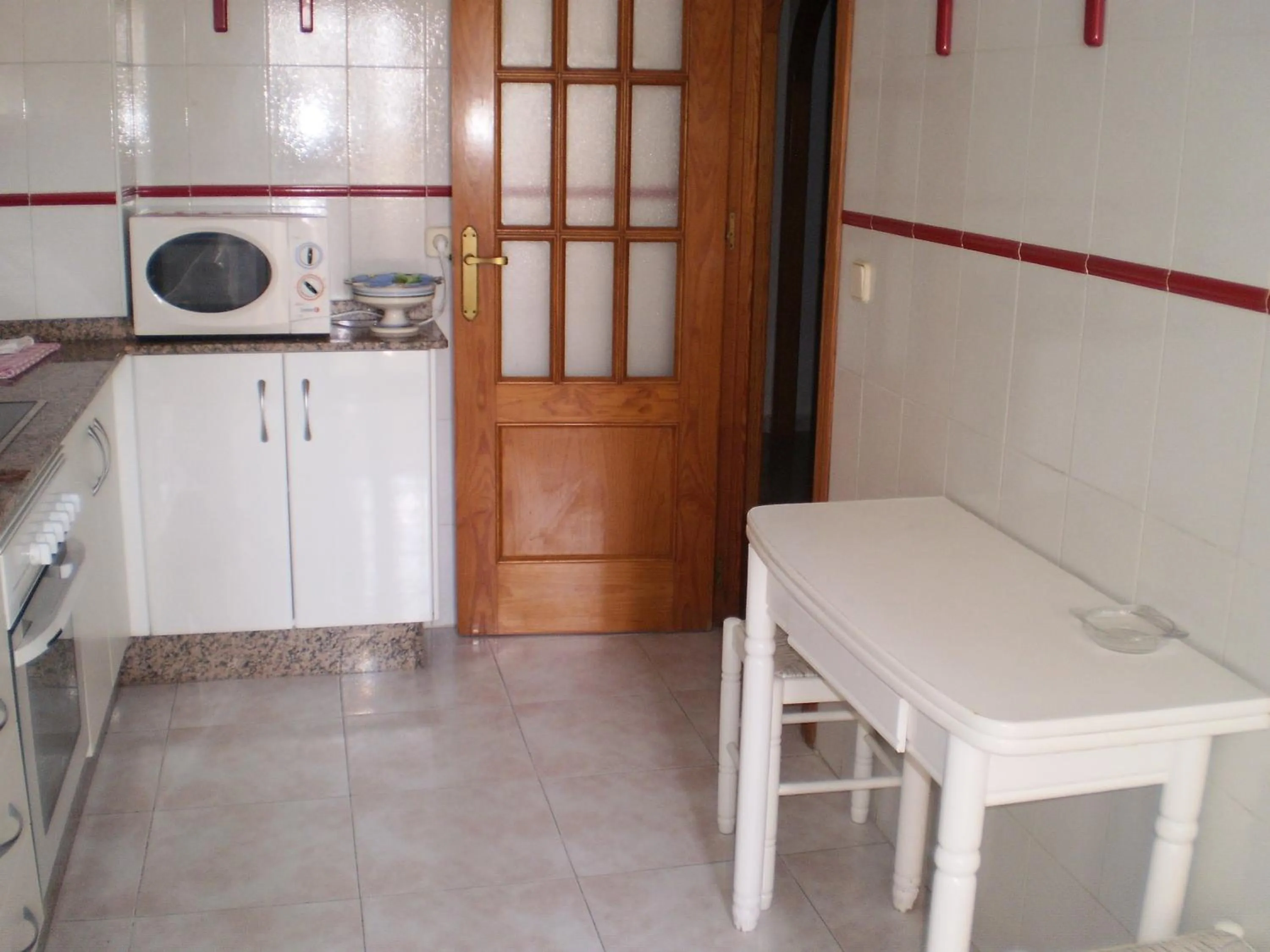 Kitchen or kitchenette in Apartamentos Copacabana Playa