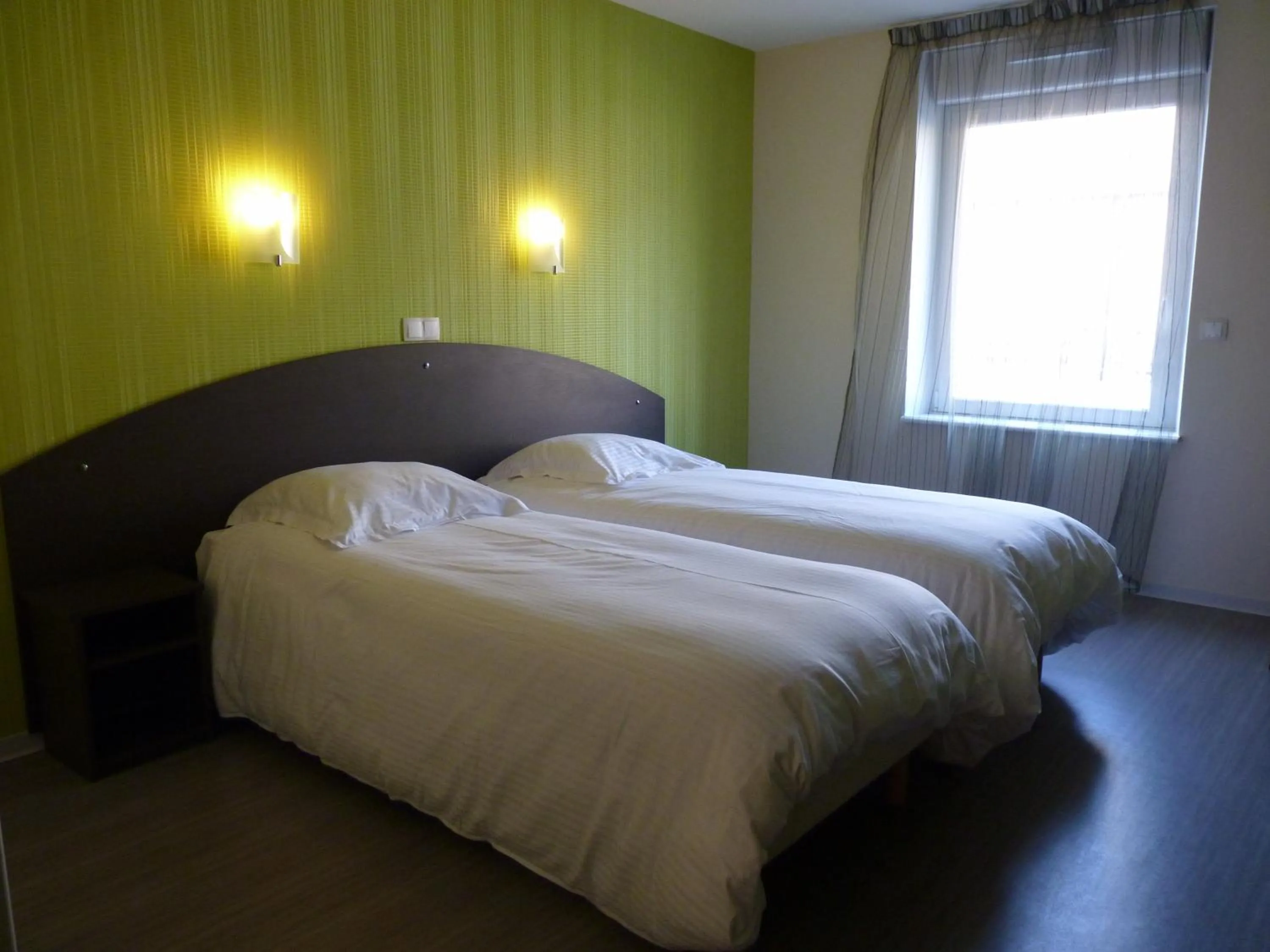 Bed in Auberge de la Baie