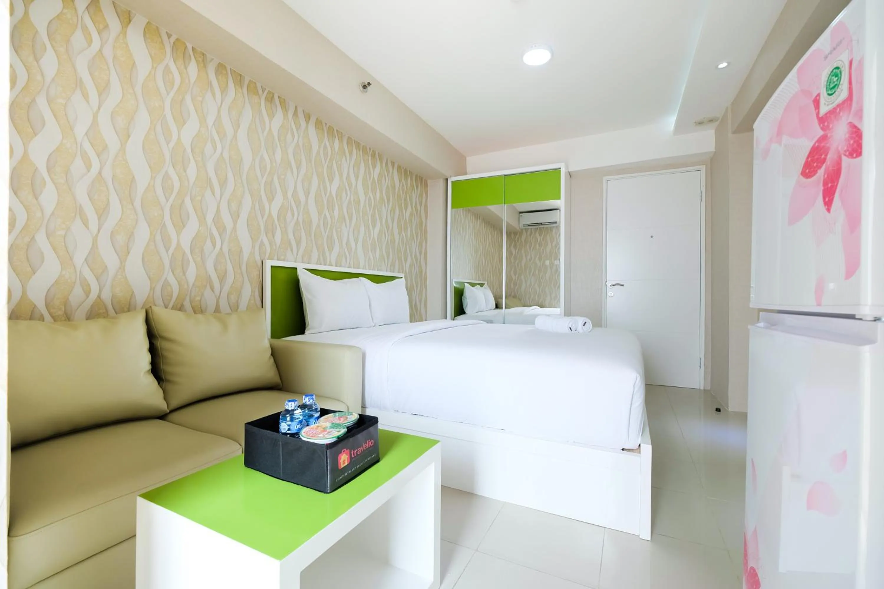 Bed in Modern Studio Bassura City Apartment By Travelio