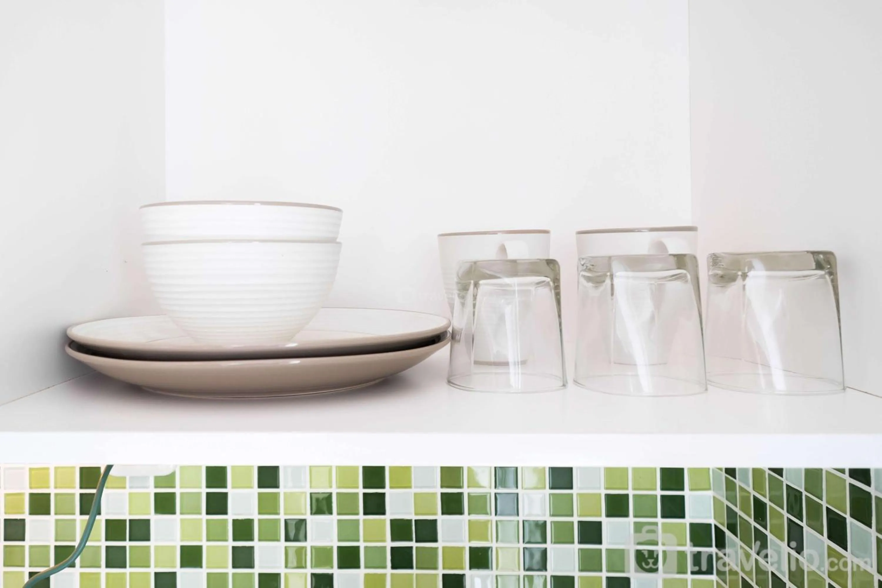 Kitchen or kitchenette in Modern Studio Bassura City Apartment By Travelio