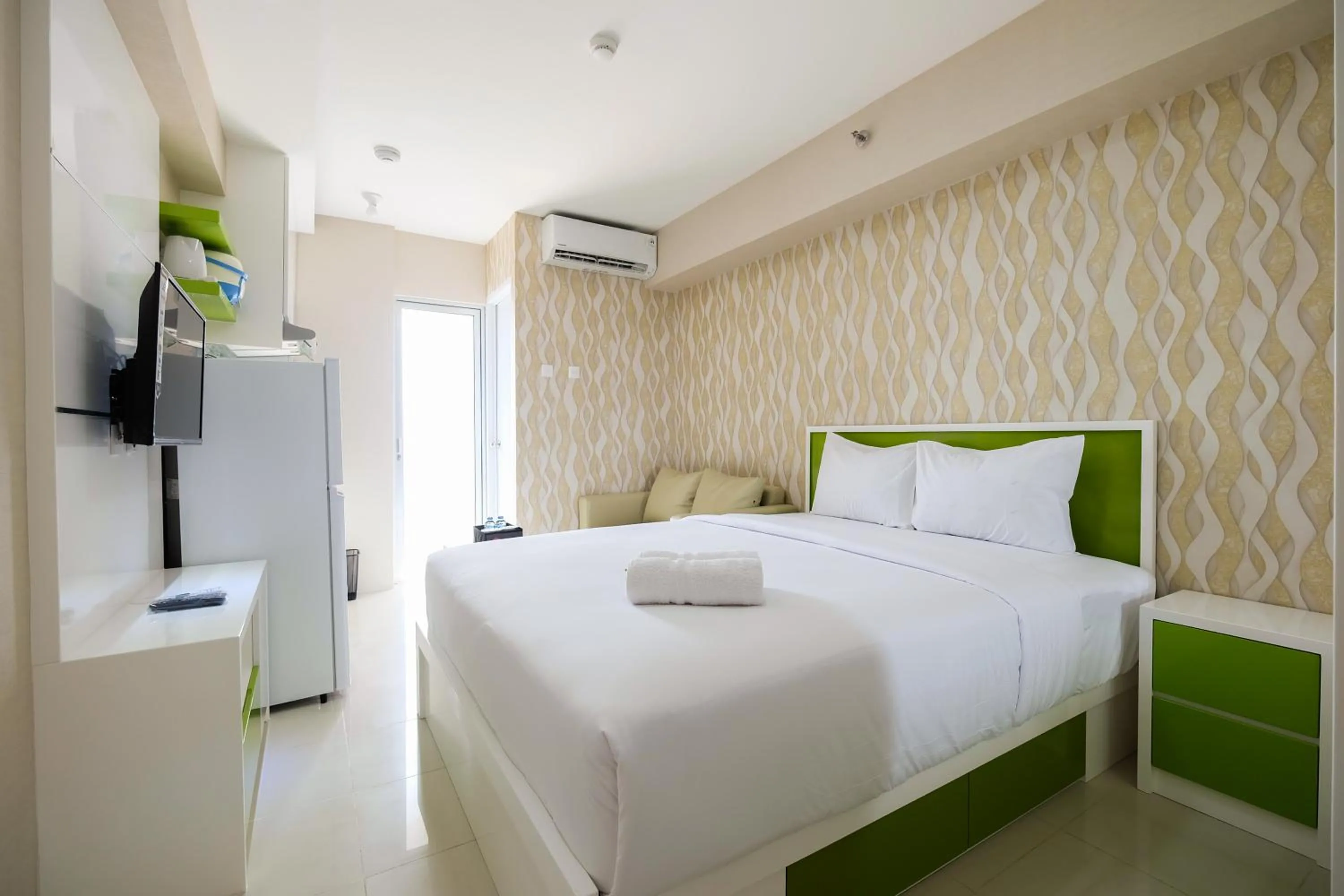 Property building, Bed in Modern Studio Bassura City Apartment By Travelio