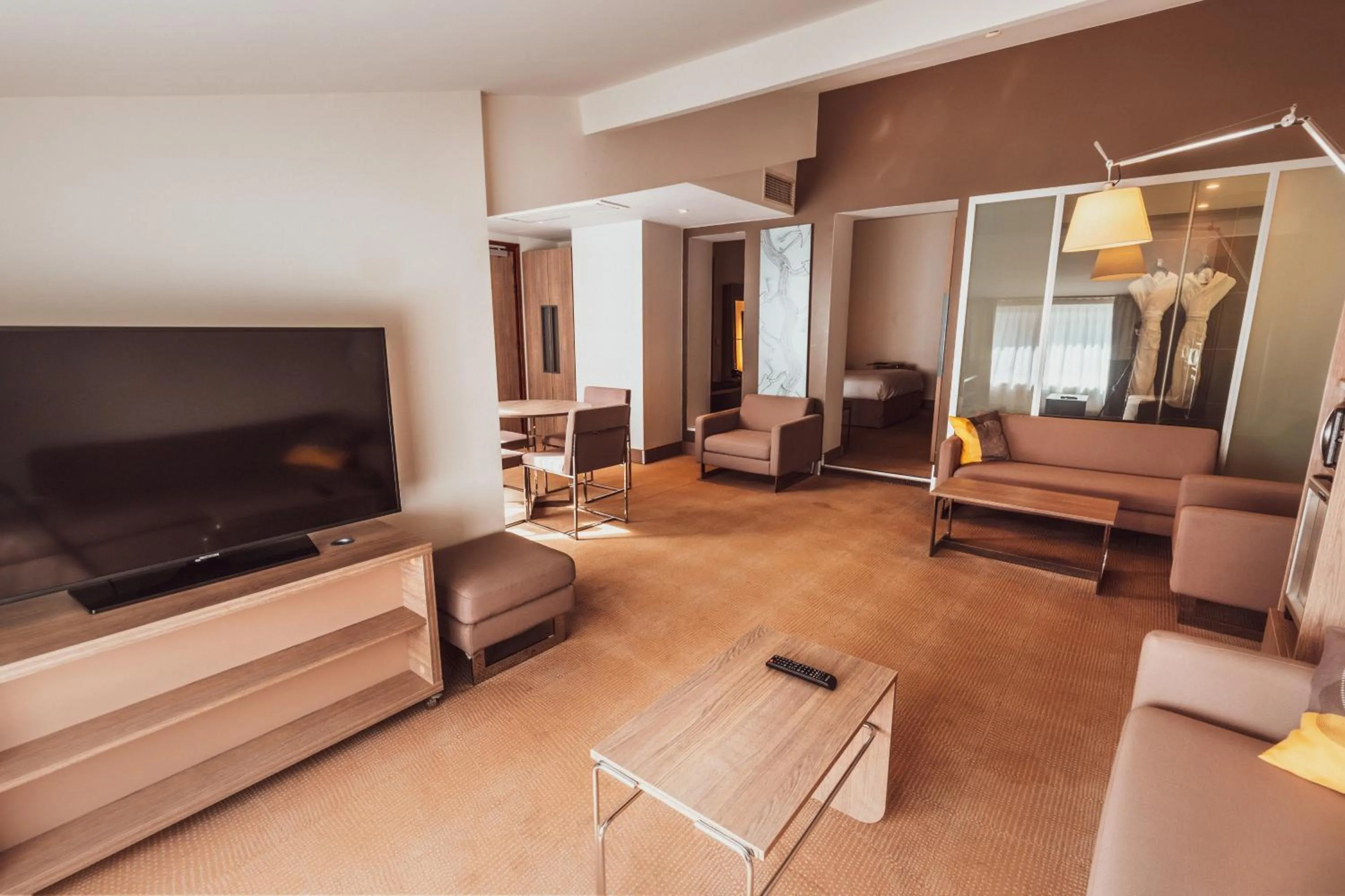 Communal lounge/ TV room in Novotel Toulouse Centre Wilson