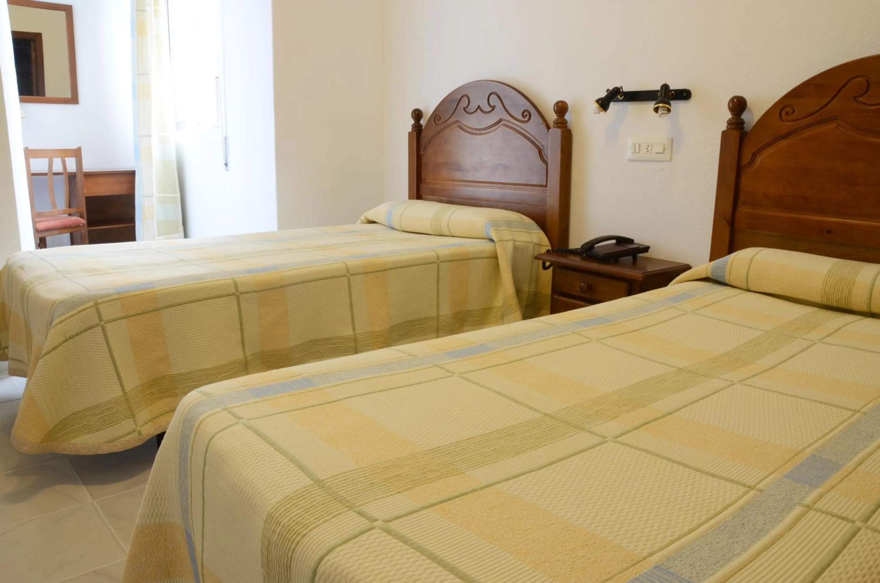 Bed in Hotel El Coloso