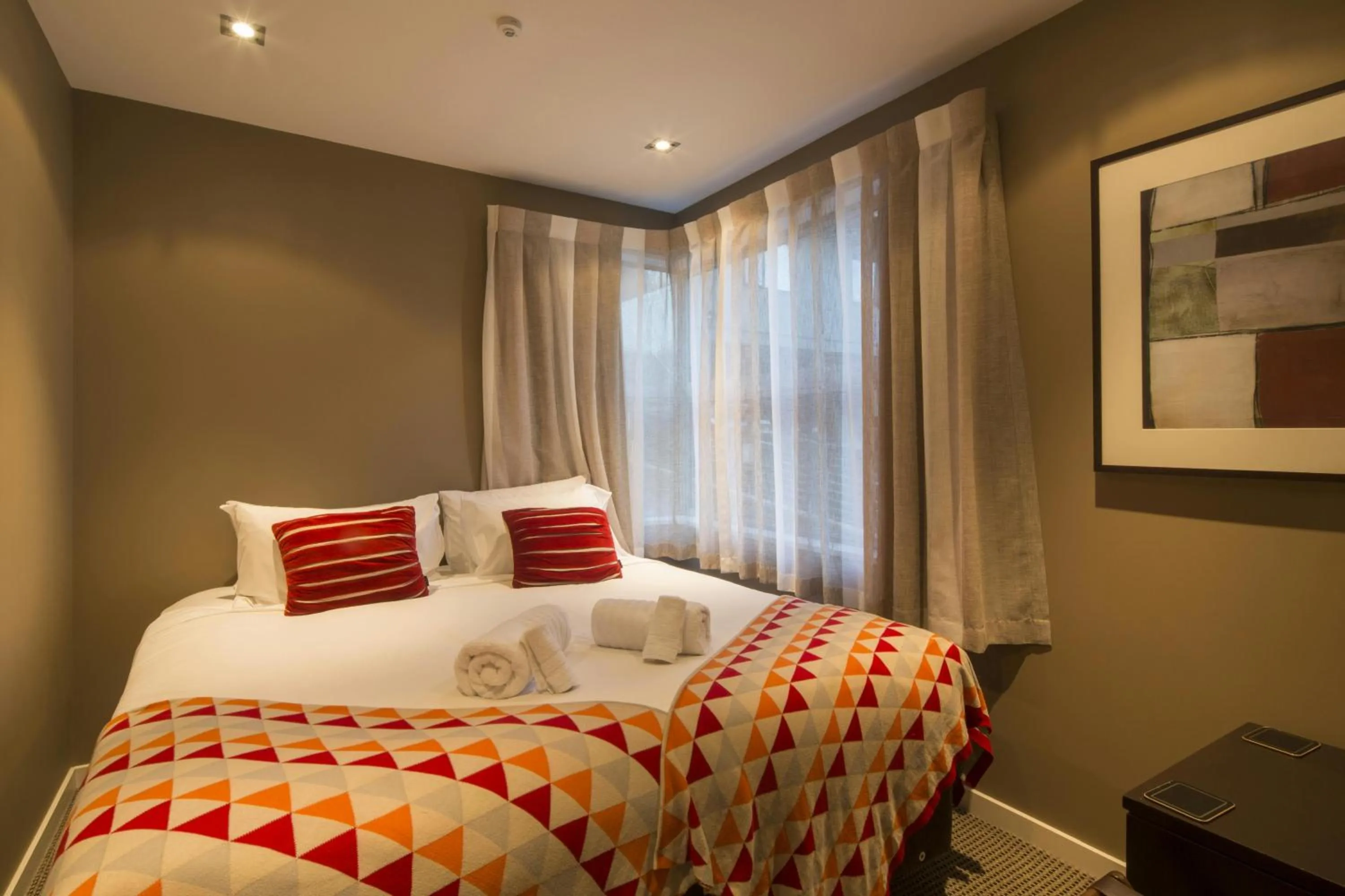 Bed in LakeRidge Queenstown by Staysouth