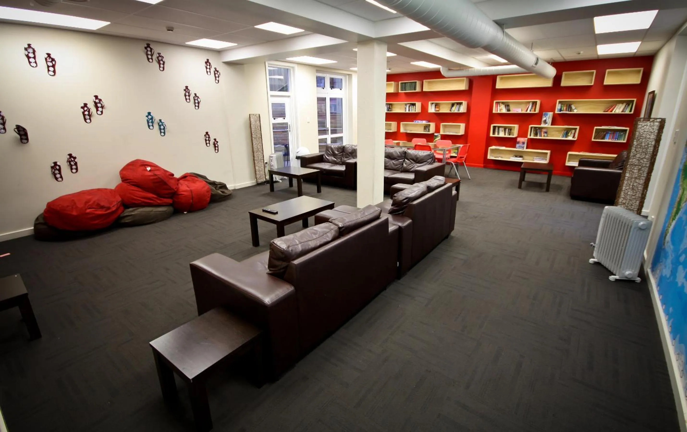 Communal lounge/ TV room in Trek Global Backpackers