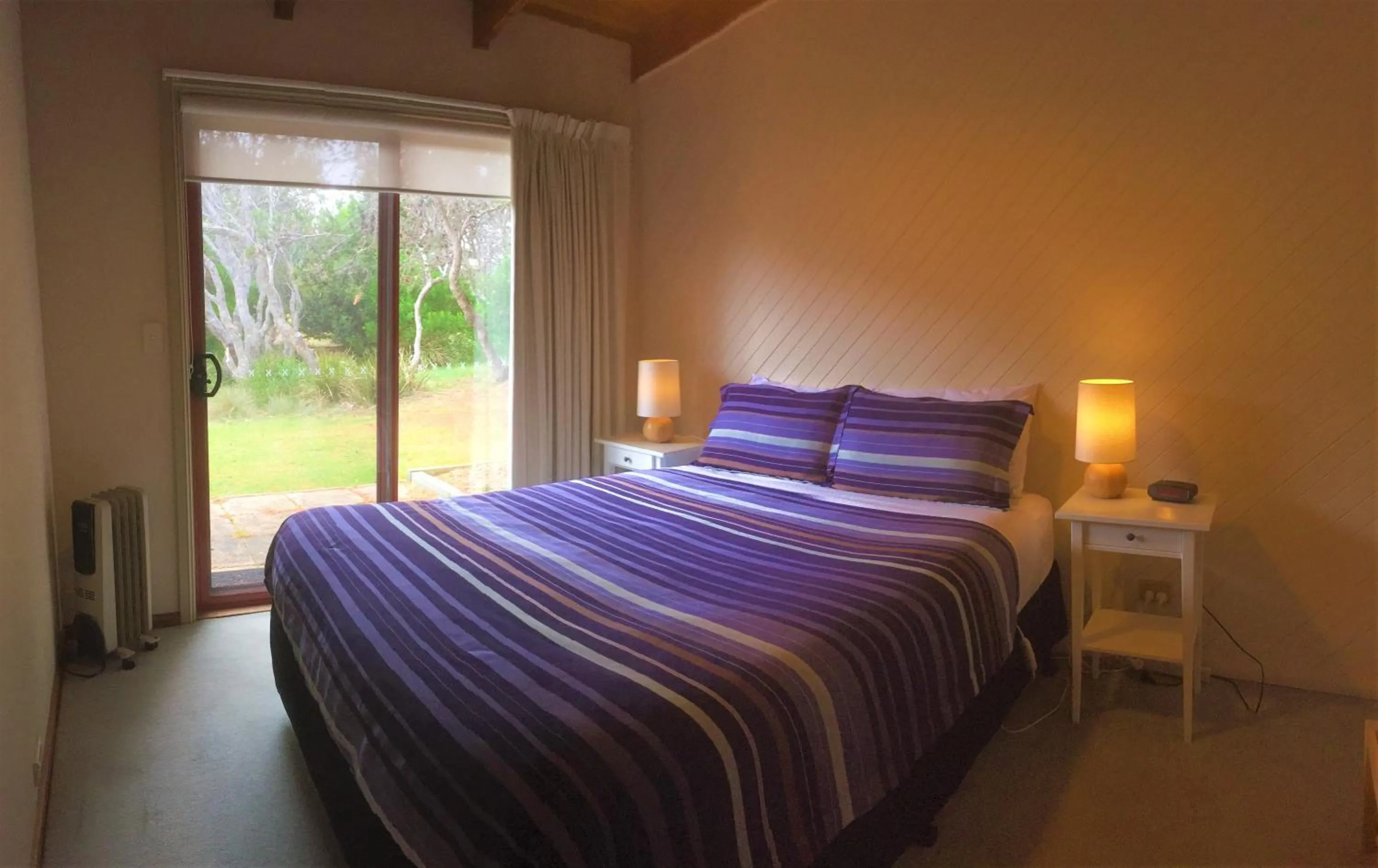 Bed in Sandpiper Ocean Cottages