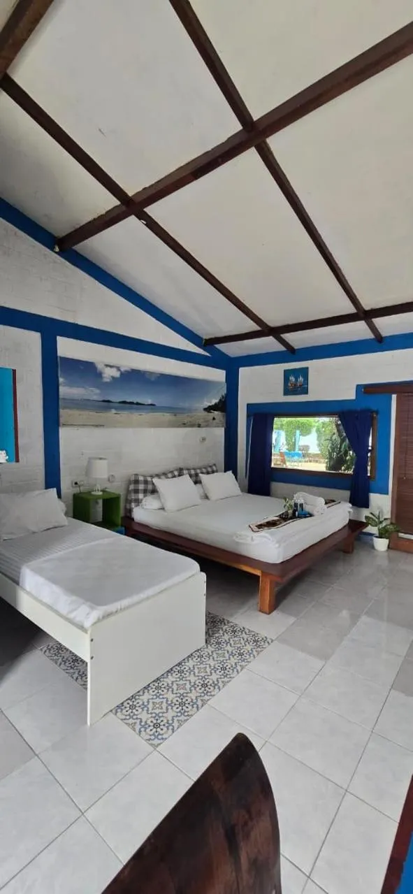 Bed in Omah Alchy Cottages