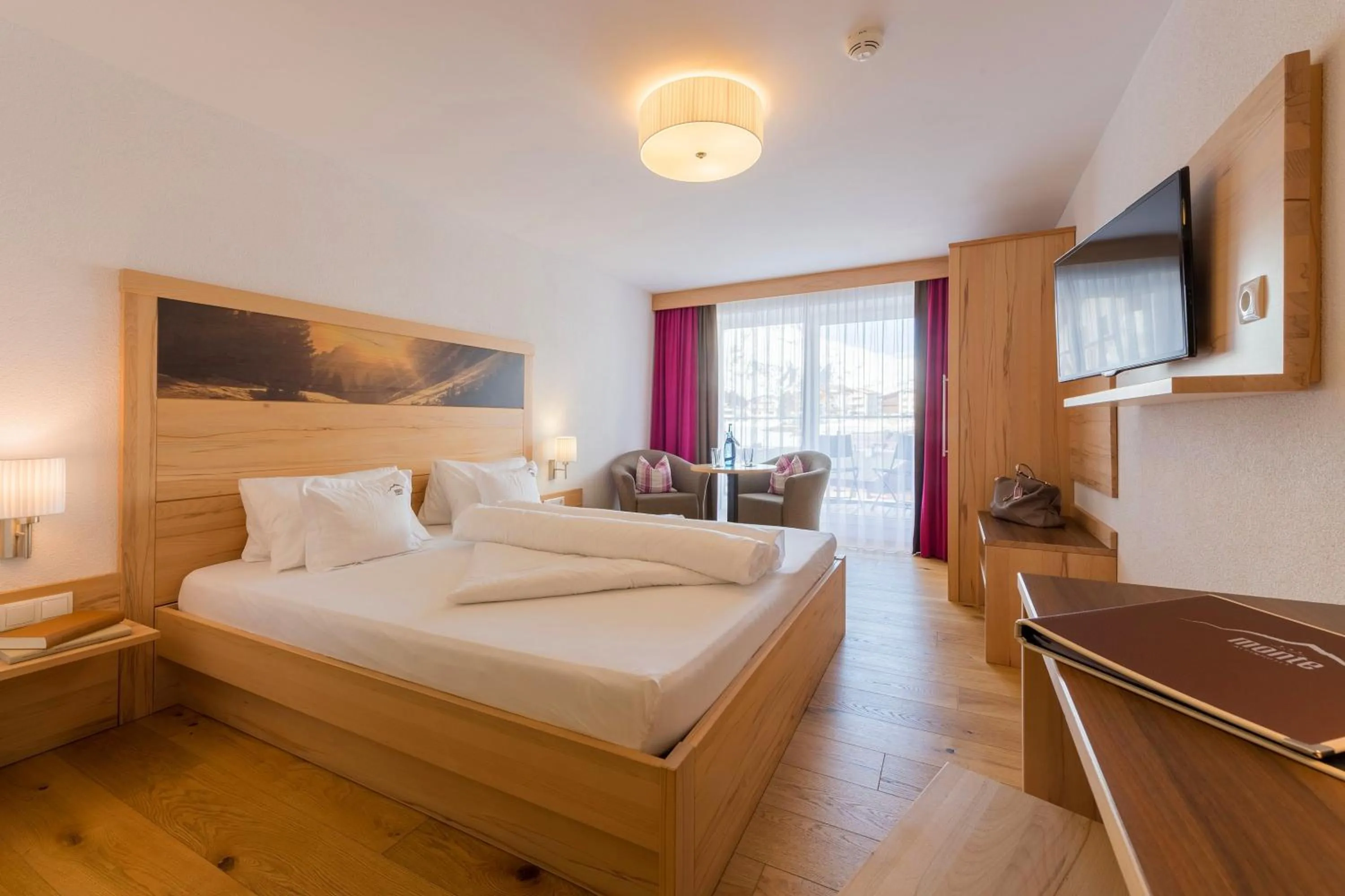 Photo of the whole room, Bed in Alpinhotel Monte Superior - Silvretta Card Premium Betrieb