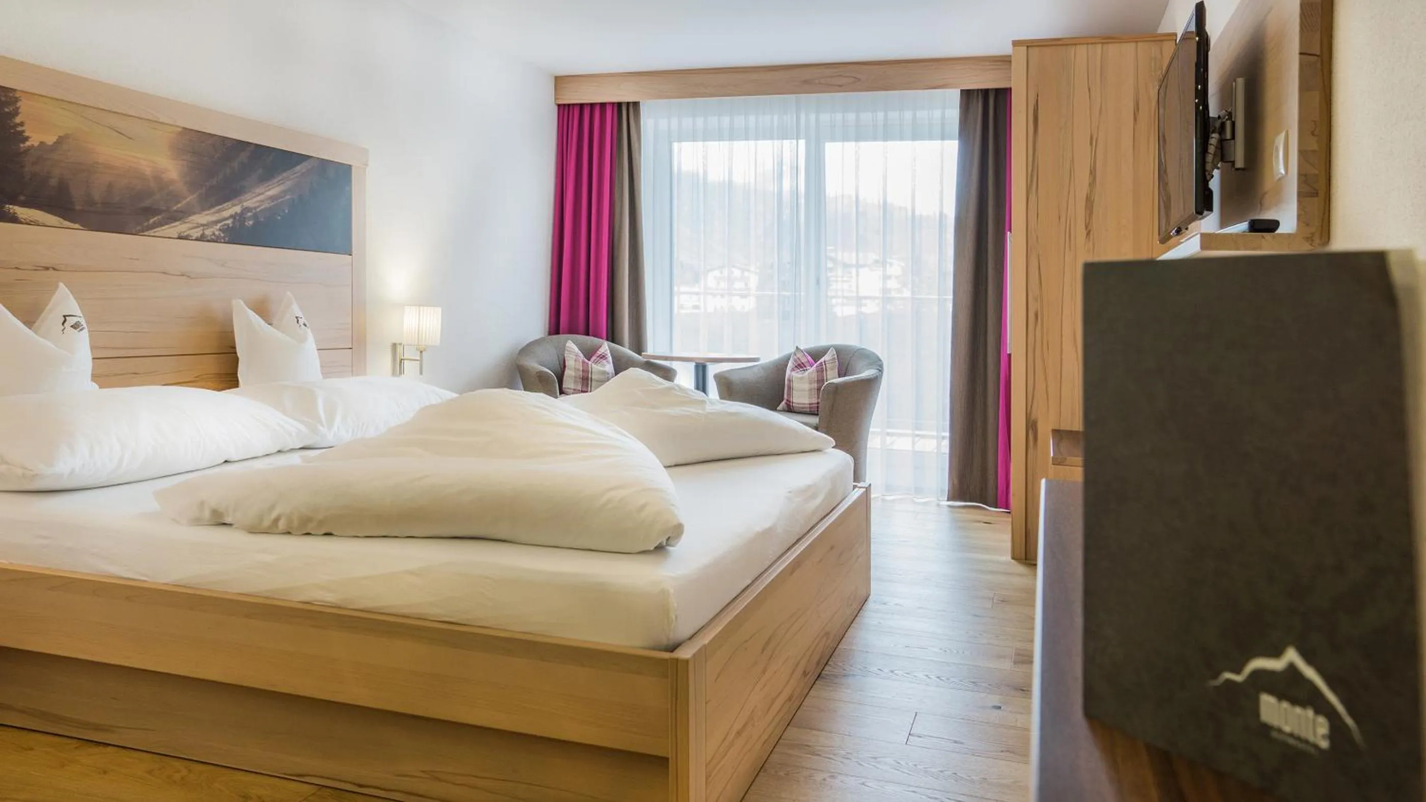 Photo of the whole room, Bed in Alpinhotel Monte Superior - Silvretta Card Premium Betrieb