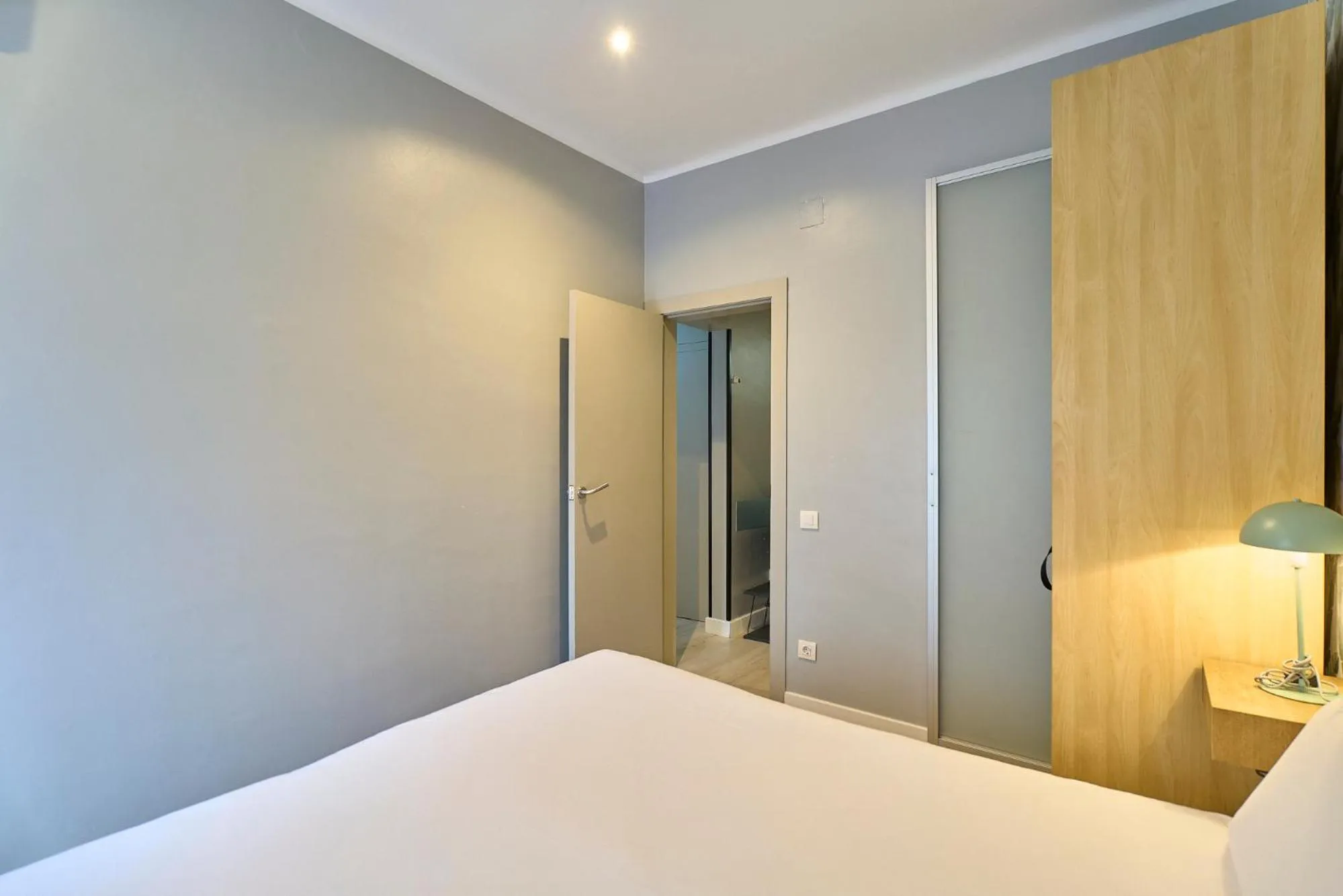 Bed in Fira Apartments by gaiarooms