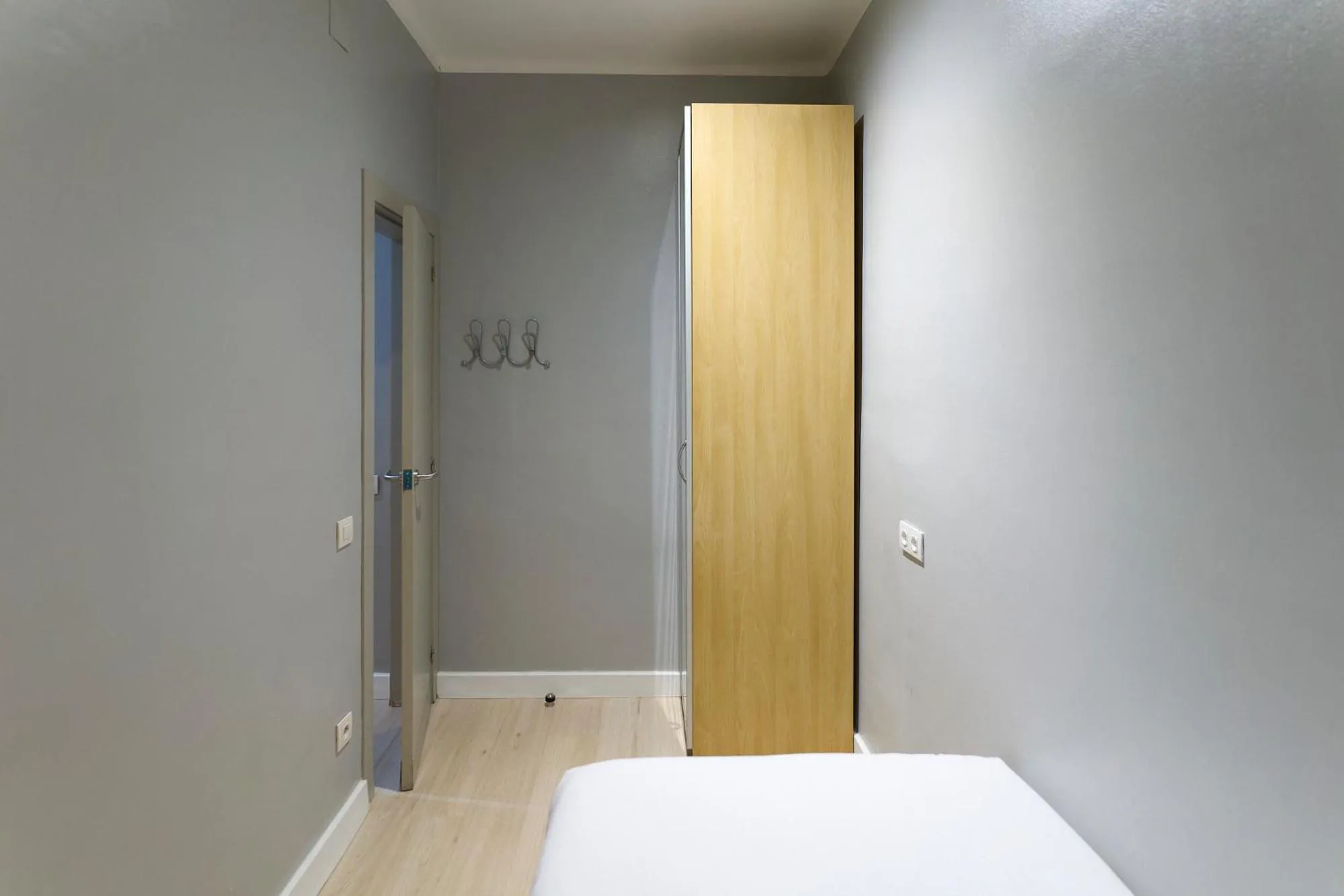 Bed in Fira Apartments by gaiarooms