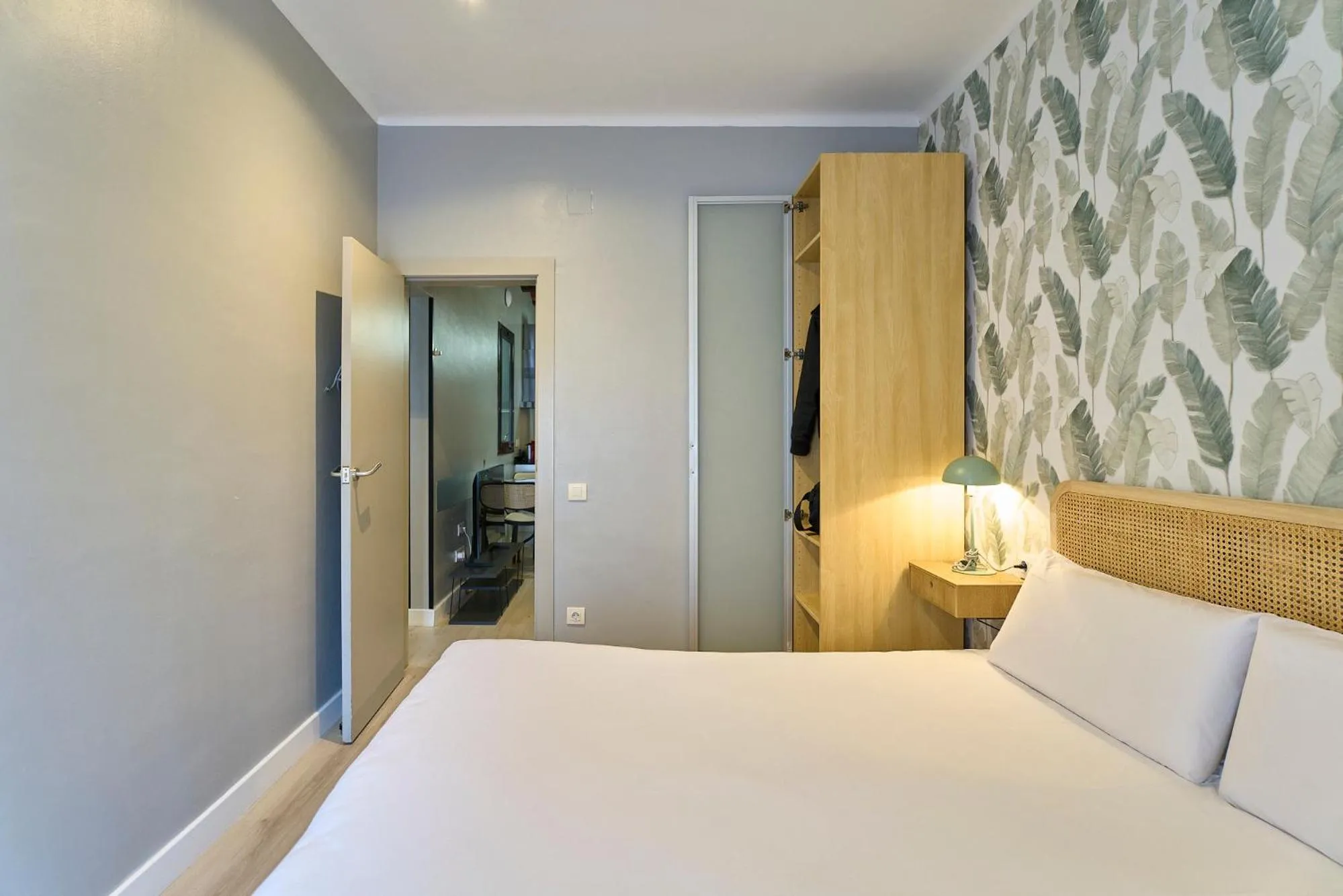 Bed in Fira Apartments by gaiarooms