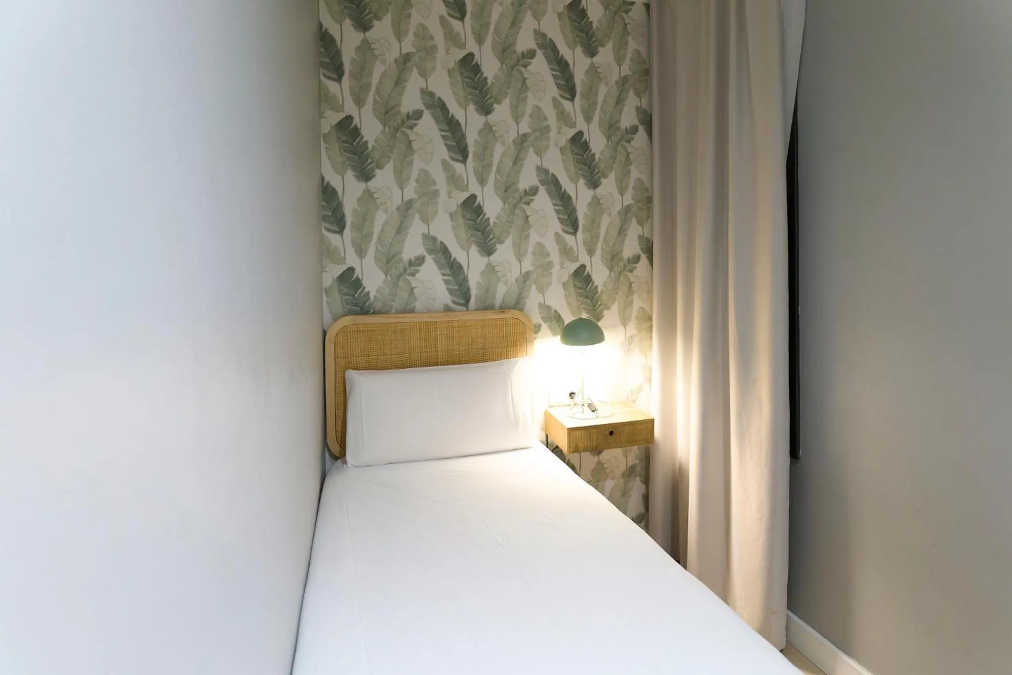 Bed in Fira Apartments by gaiarooms