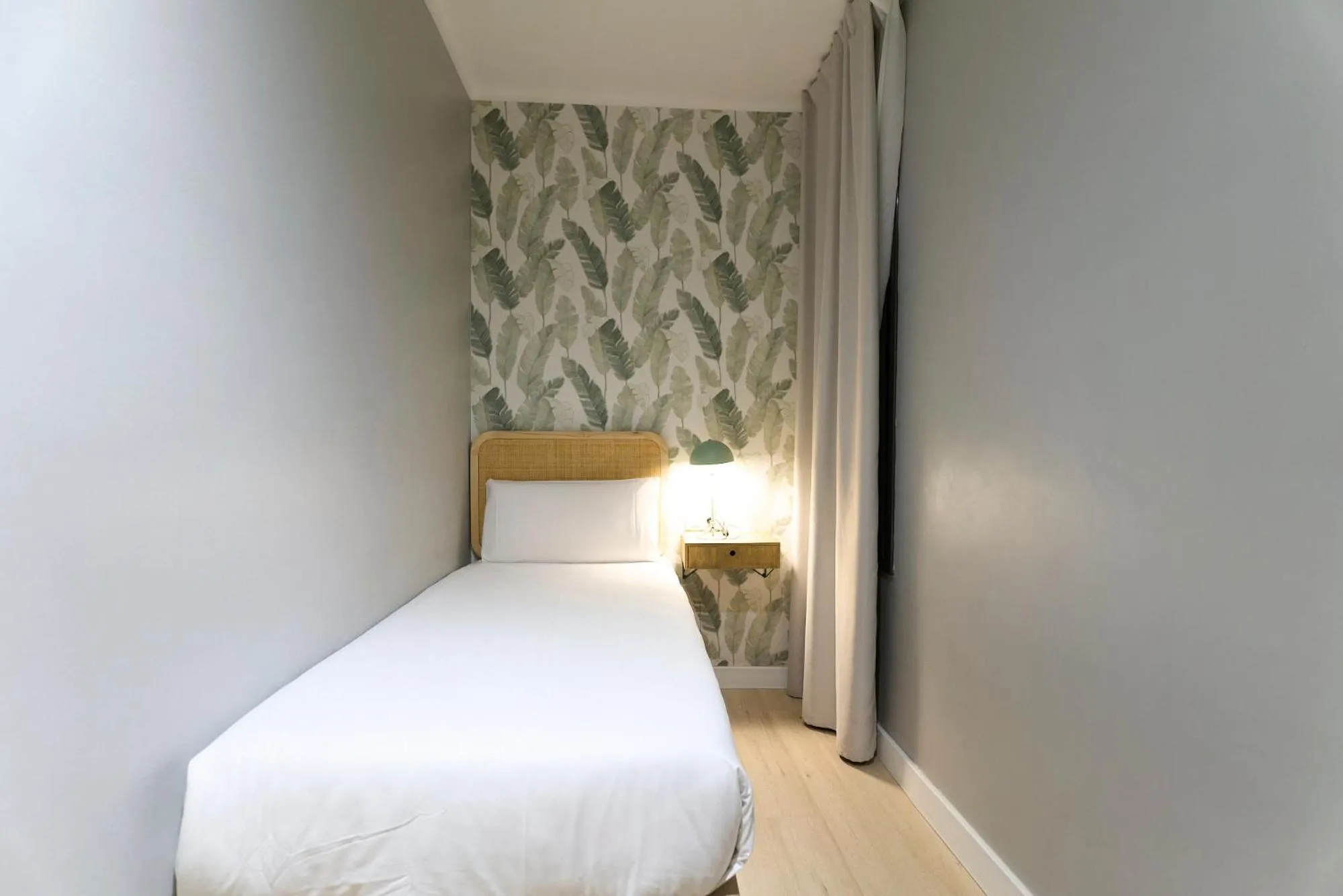 Bed in Fira Apartments by gaiarooms