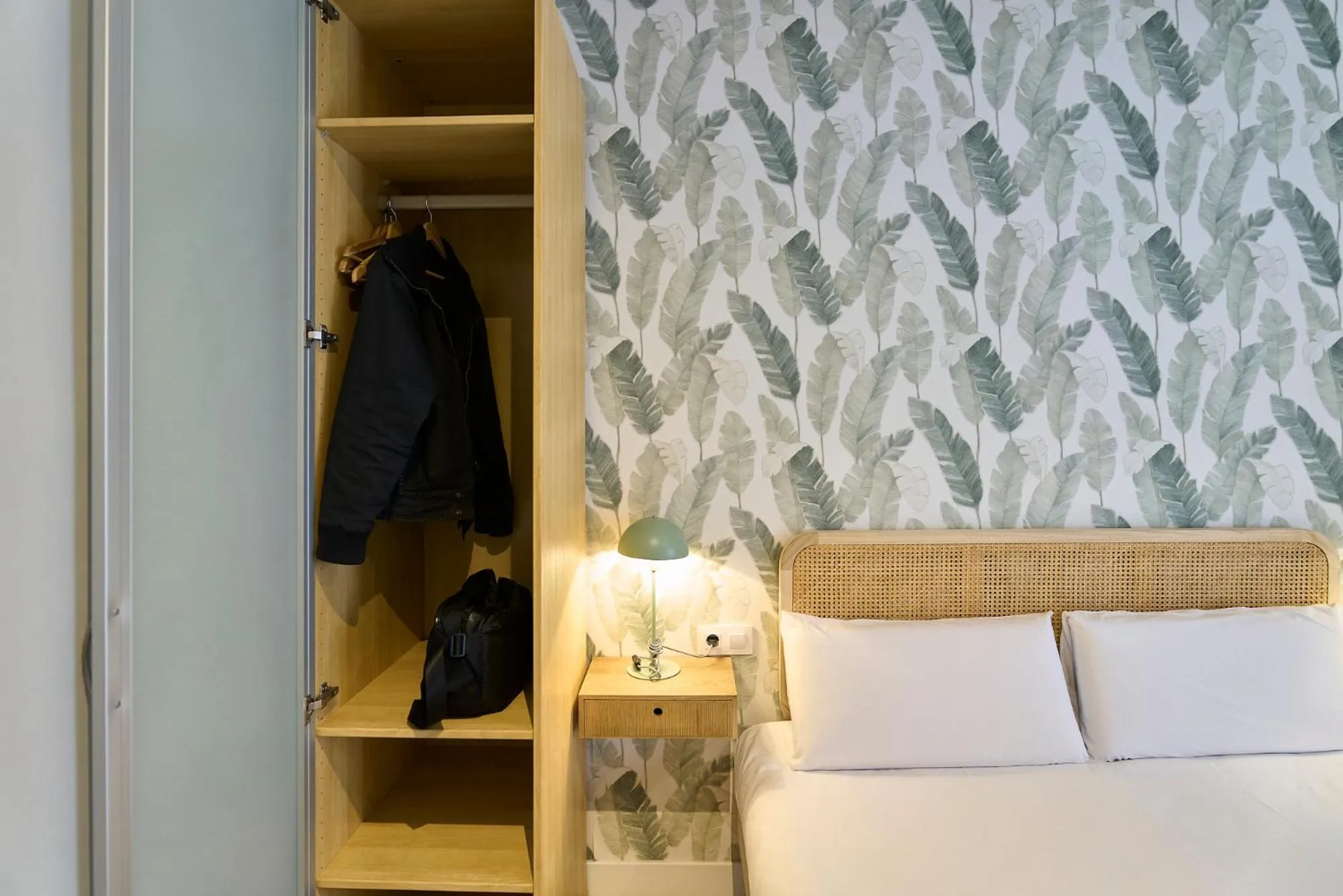 Bed in Fira Apartments by gaiarooms