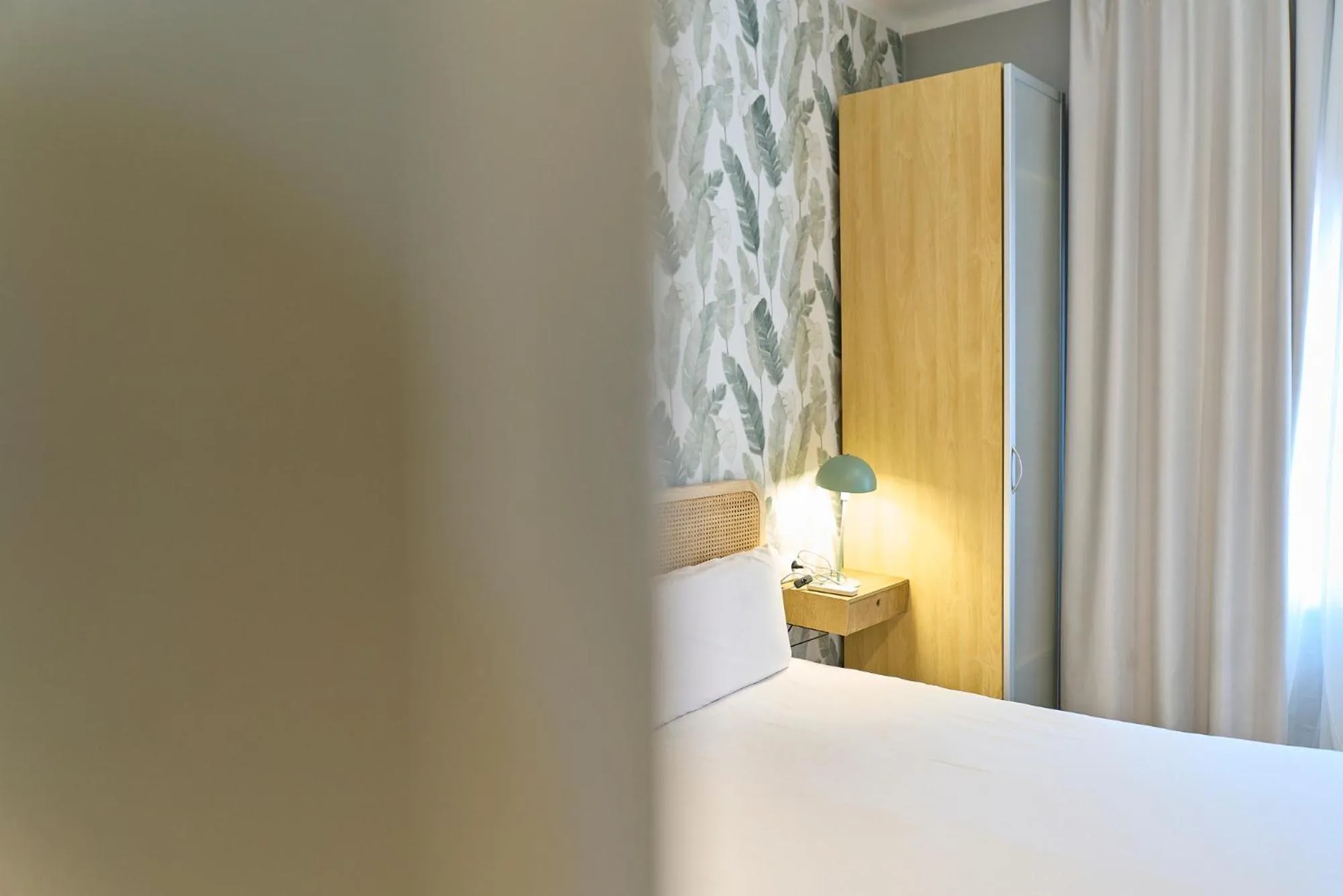 Bed in Fira Apartments by gaiarooms