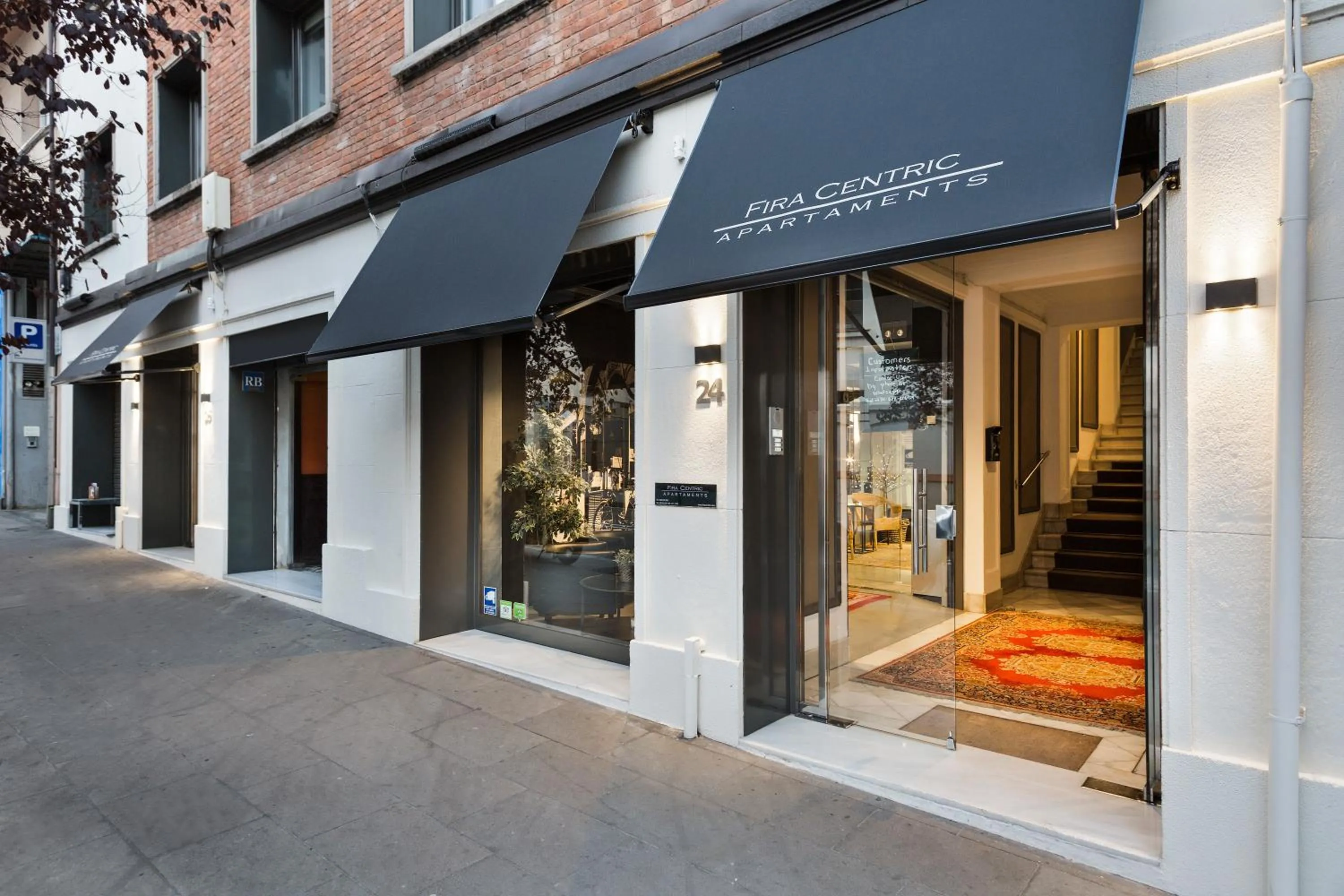 Facade/entrance in Fira Apartments by gaiarooms