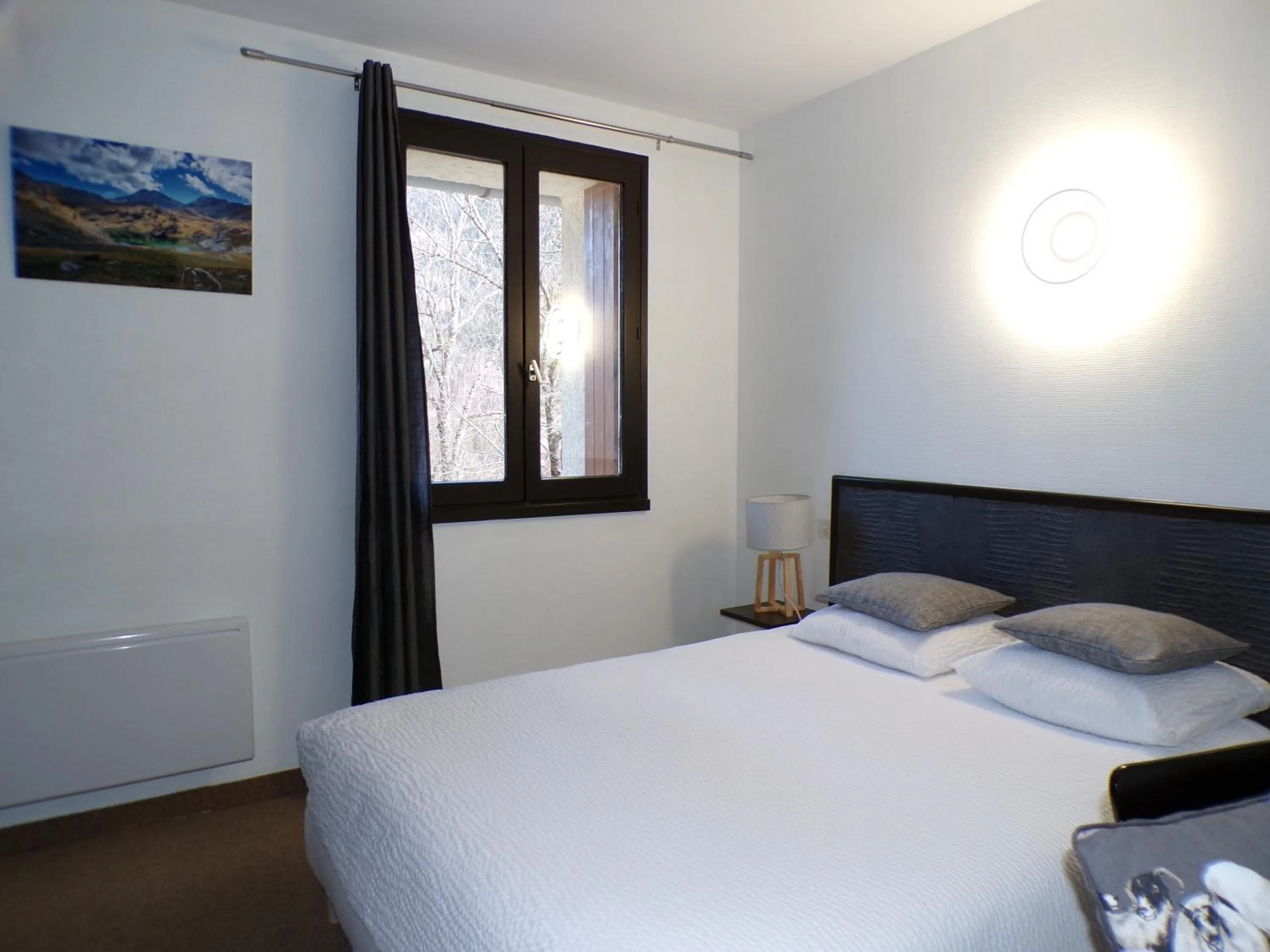 Photo of the whole room, Bed in Hôtel Le Martagon