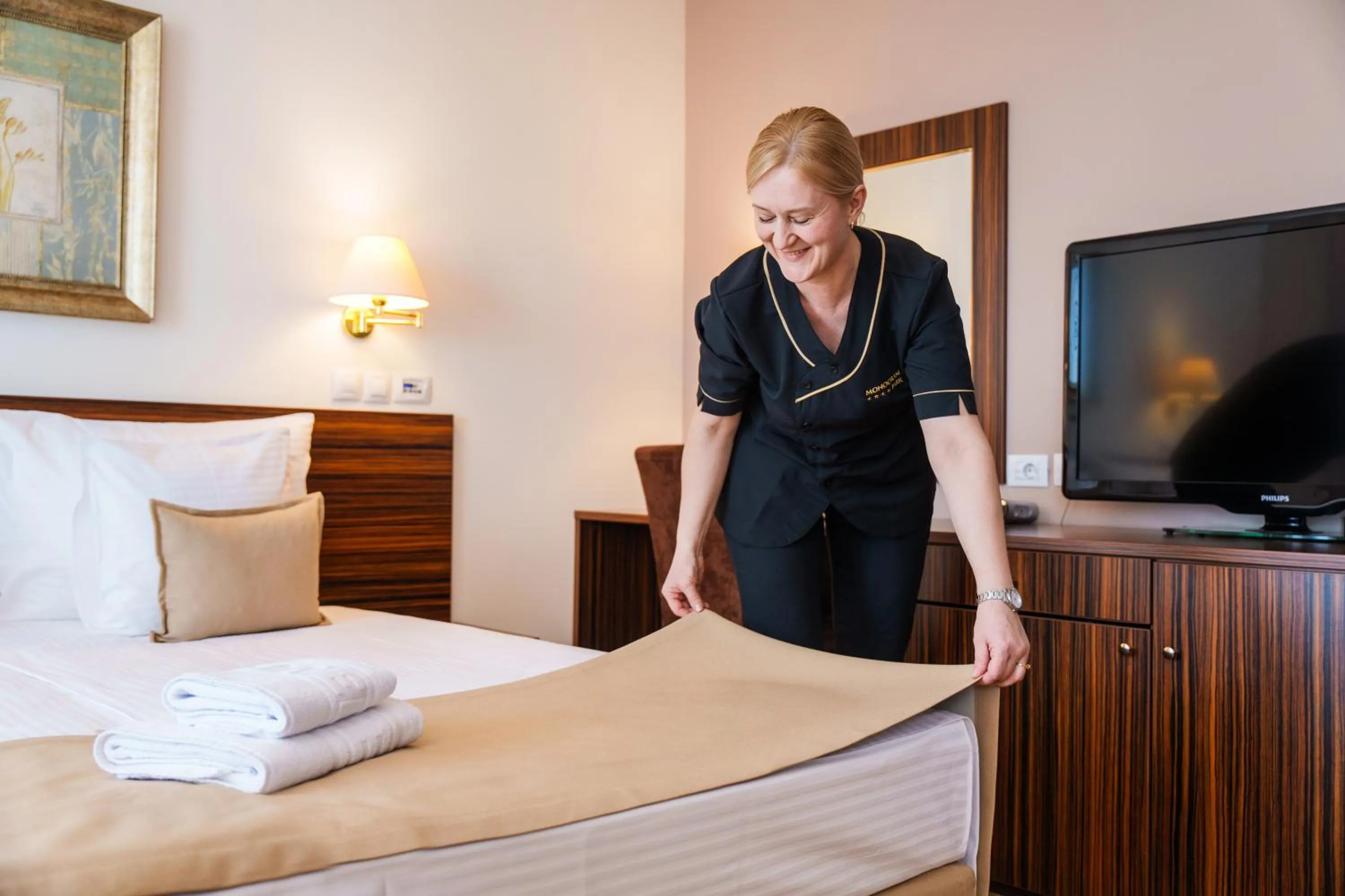 Bed in Hotel Monogram Park