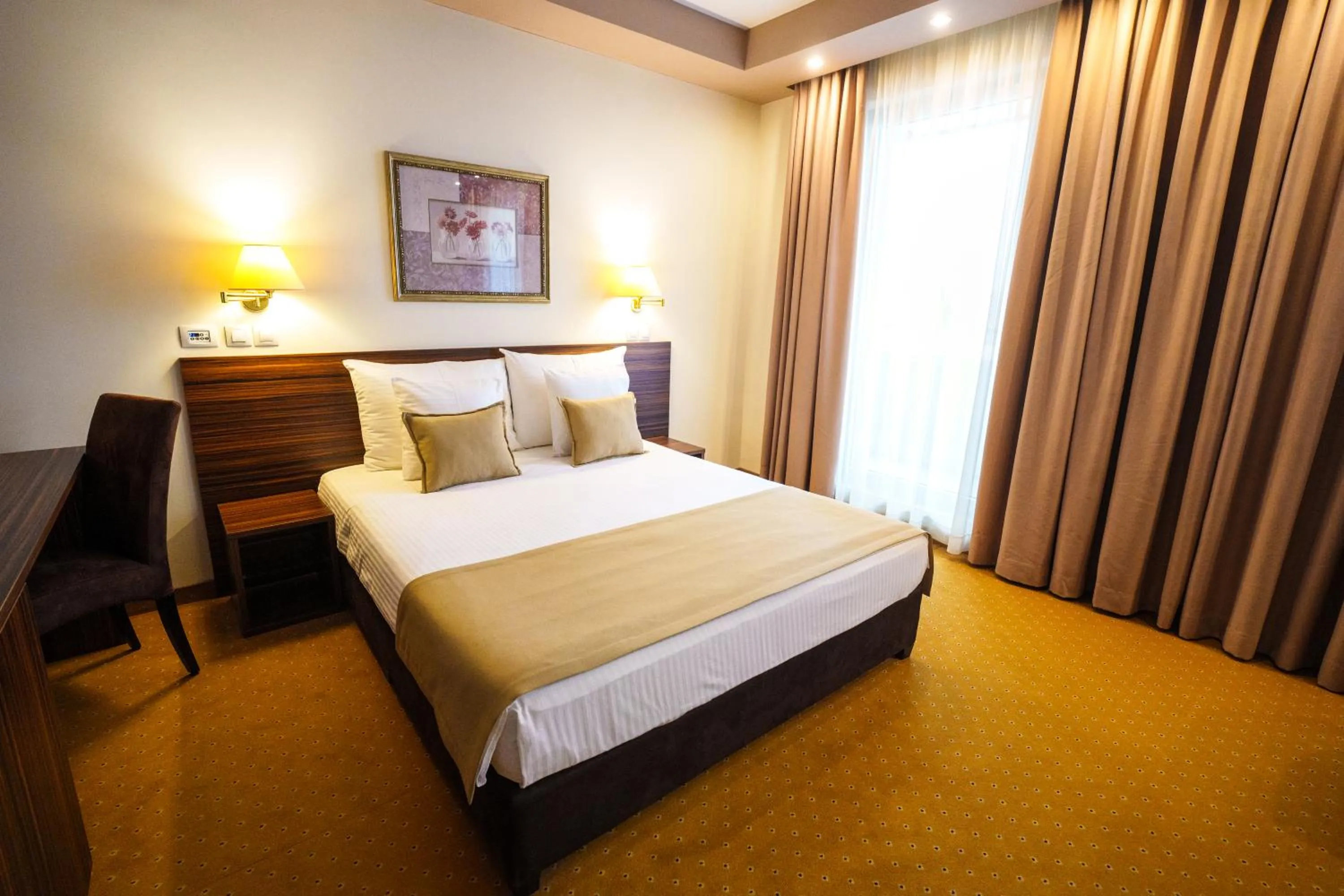 Bed in Hotel Monogram Park