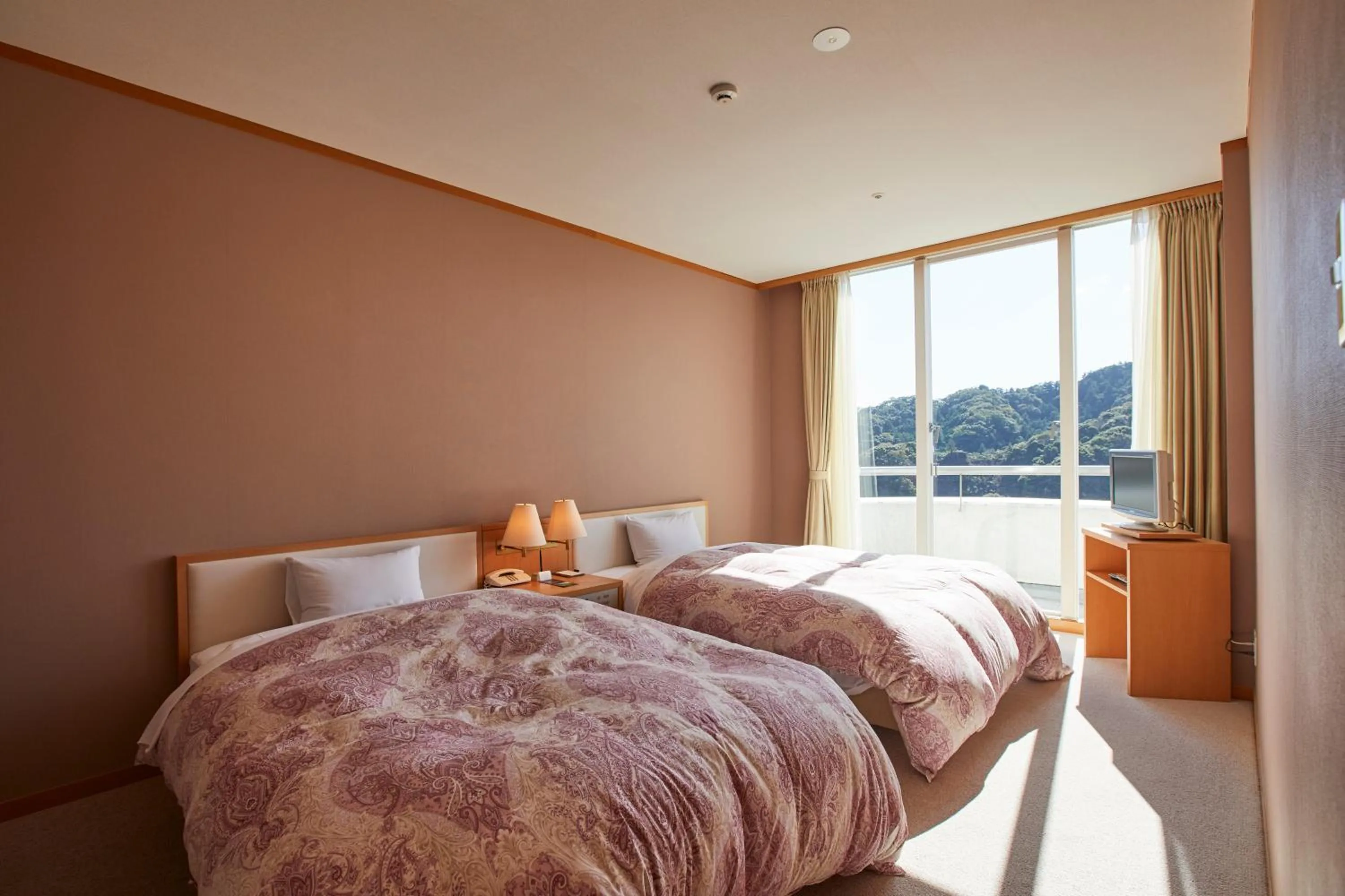 Bed in Kamogawa Country Hotel