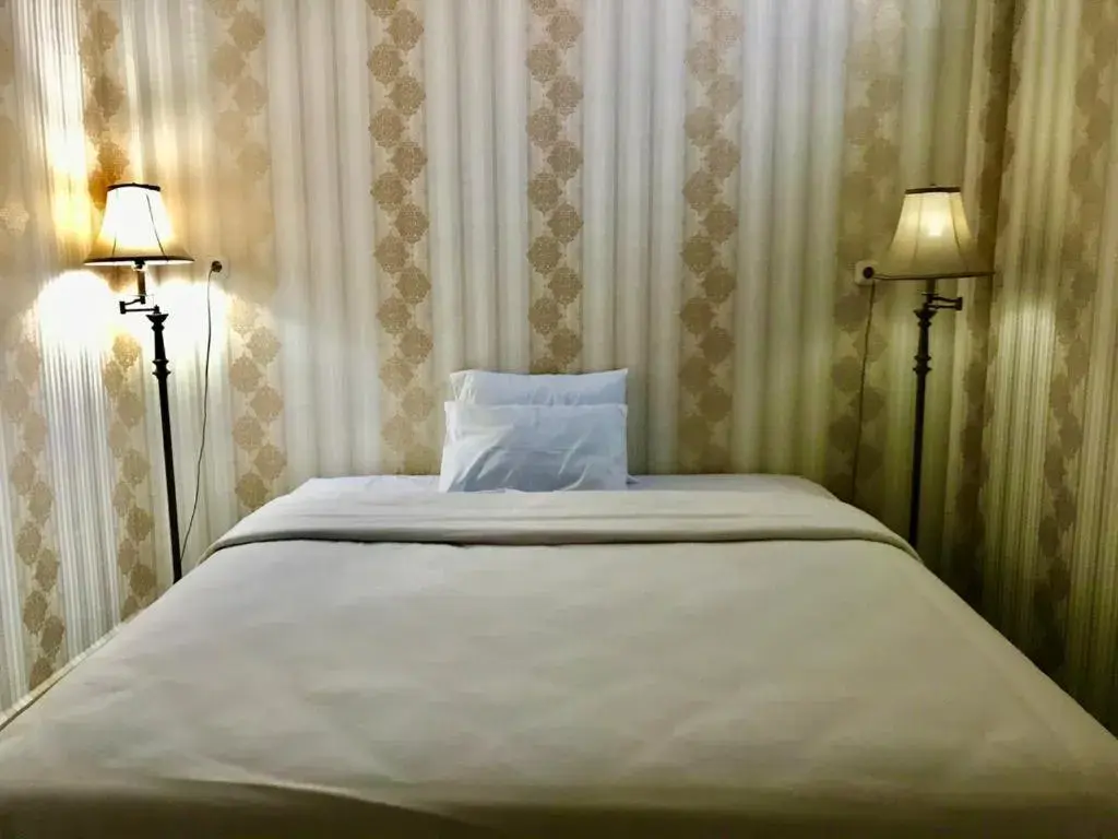 Bed in Penginapan Intan Bandara Bed in Penginapan Intan Bandara