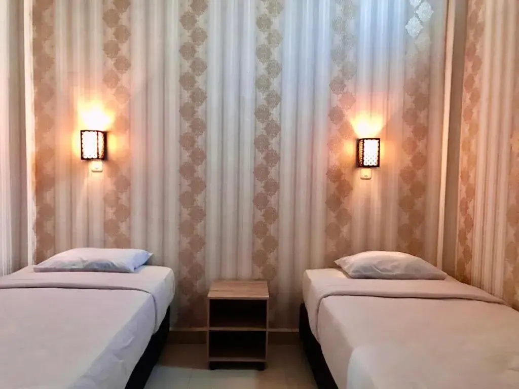 Bed in Penginapan Intan Bandara Bed in Penginapan Intan Bandara