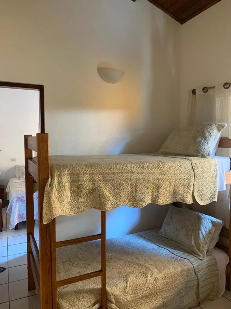 Bed in Pousada Irmãos do Mar