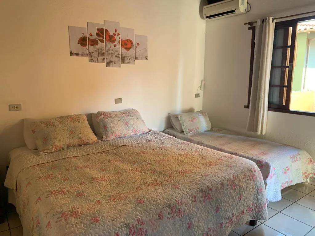 Bed in Pousada Irmãos do Mar