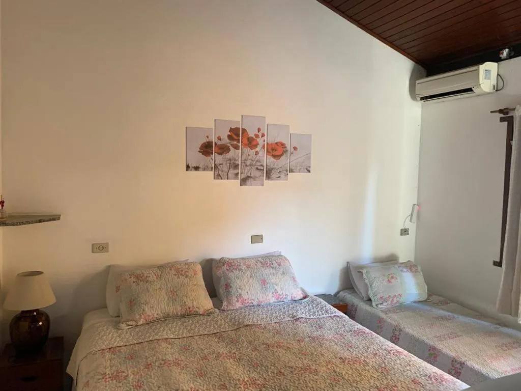 Bed in Pousada Irmãos do Mar