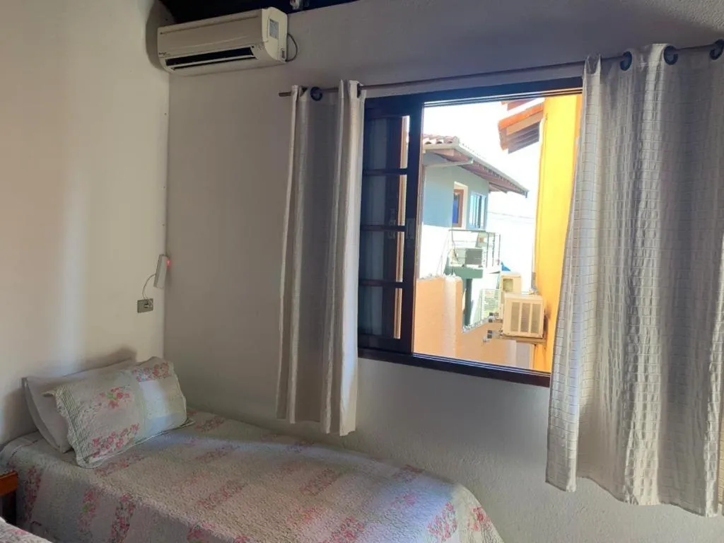 Bed in Pousada Irmãos do Mar