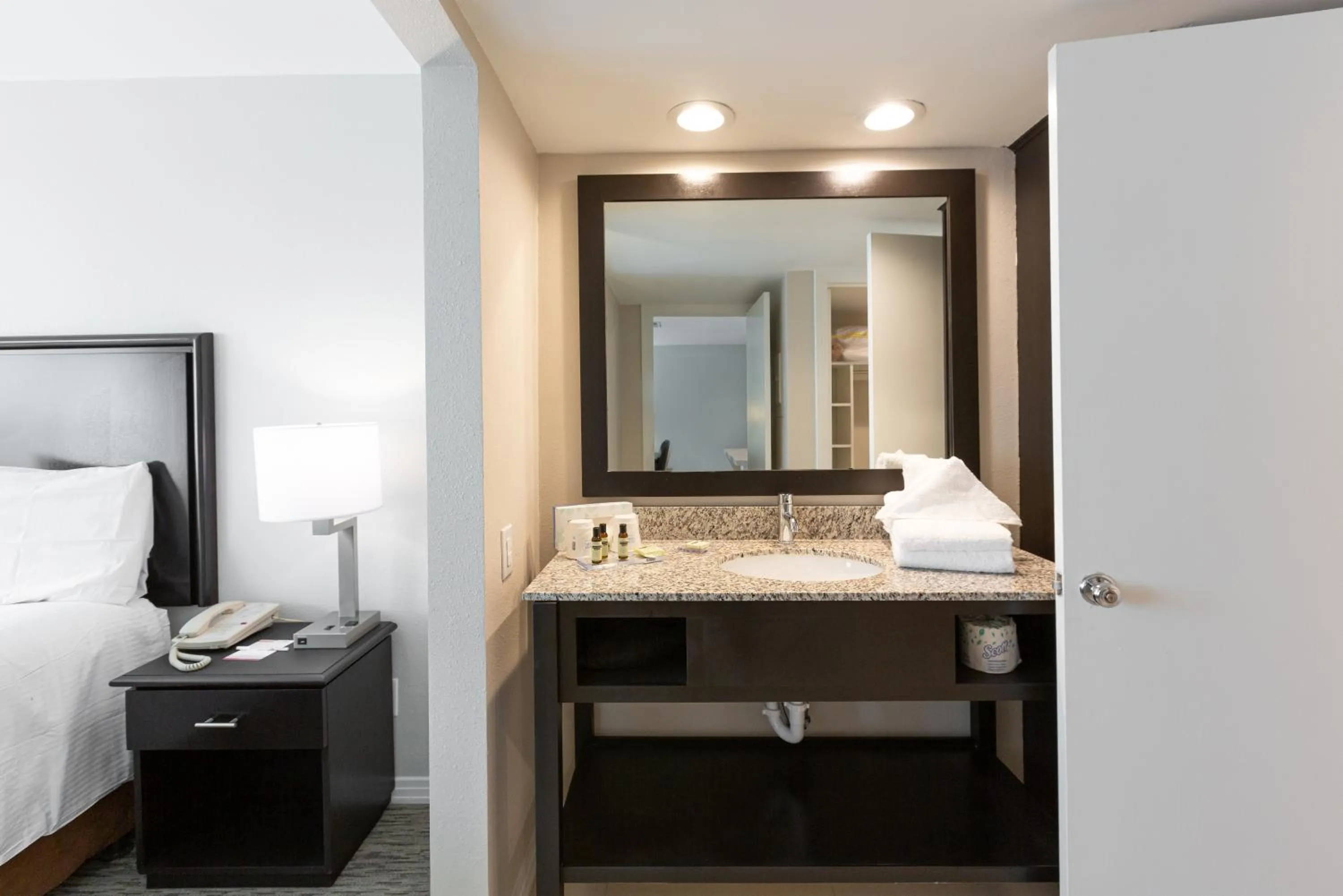 Bathroom, Bed in Value Suites Extended Stay - Arlington