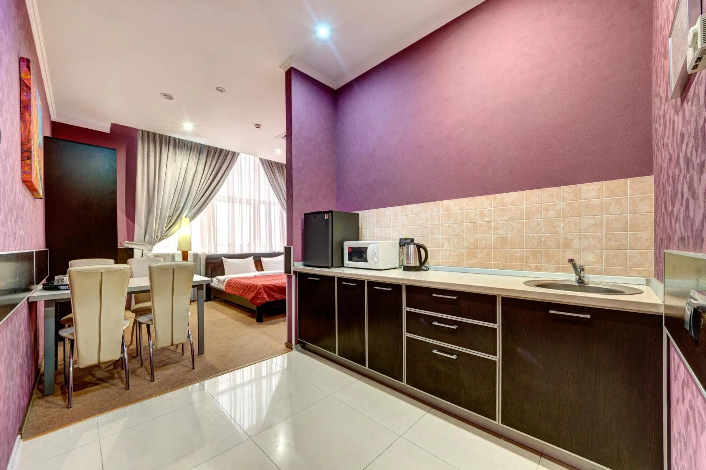 Kitchen or kitchenette, Bed in Terra Nova Sport&Spa Hotel