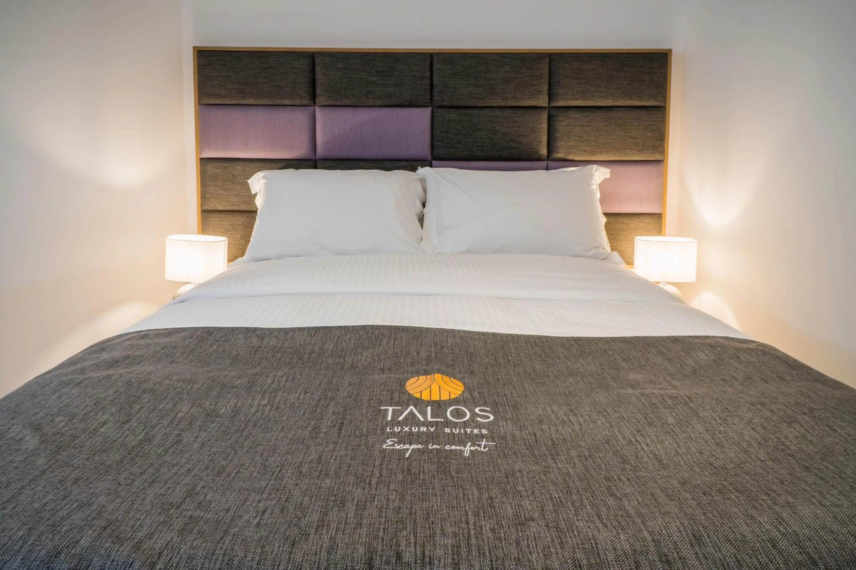 Bed in Talos Luxury Suites